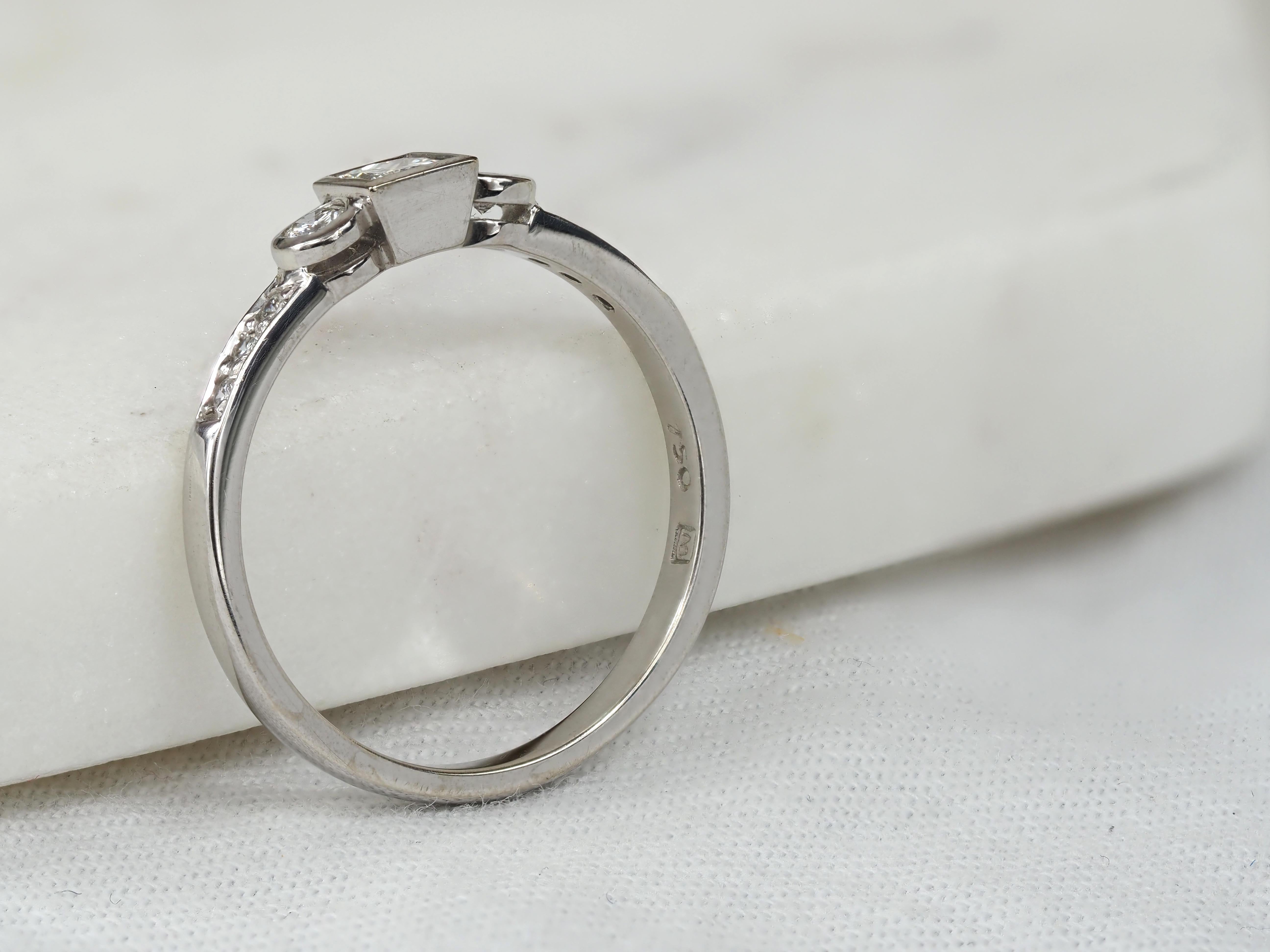 18ct White Gold Princess and Round Brillant cut Diamond Engagement Ring