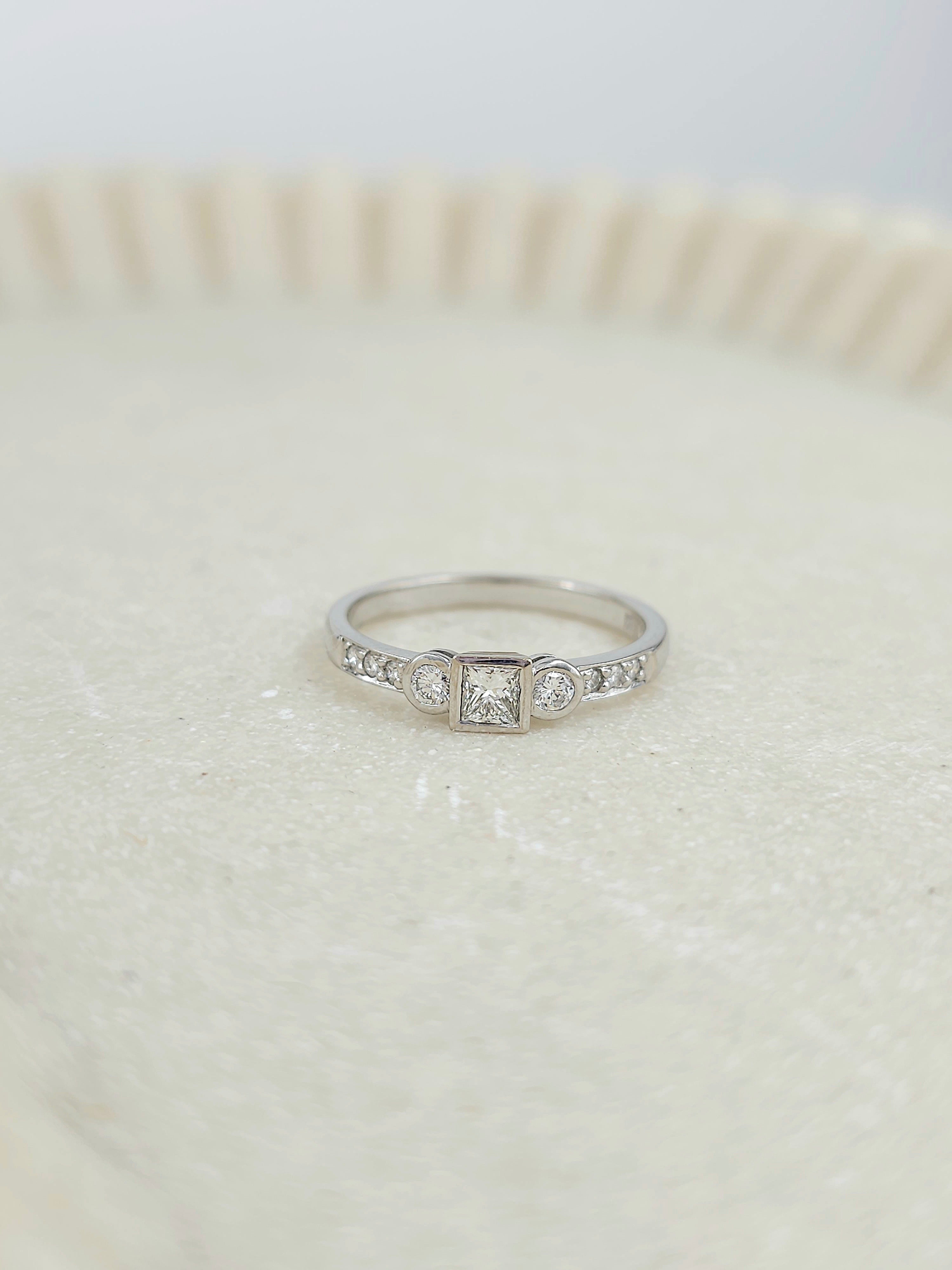 18ct White Gold Princess and Round Brillant cut Diamond engagement ring