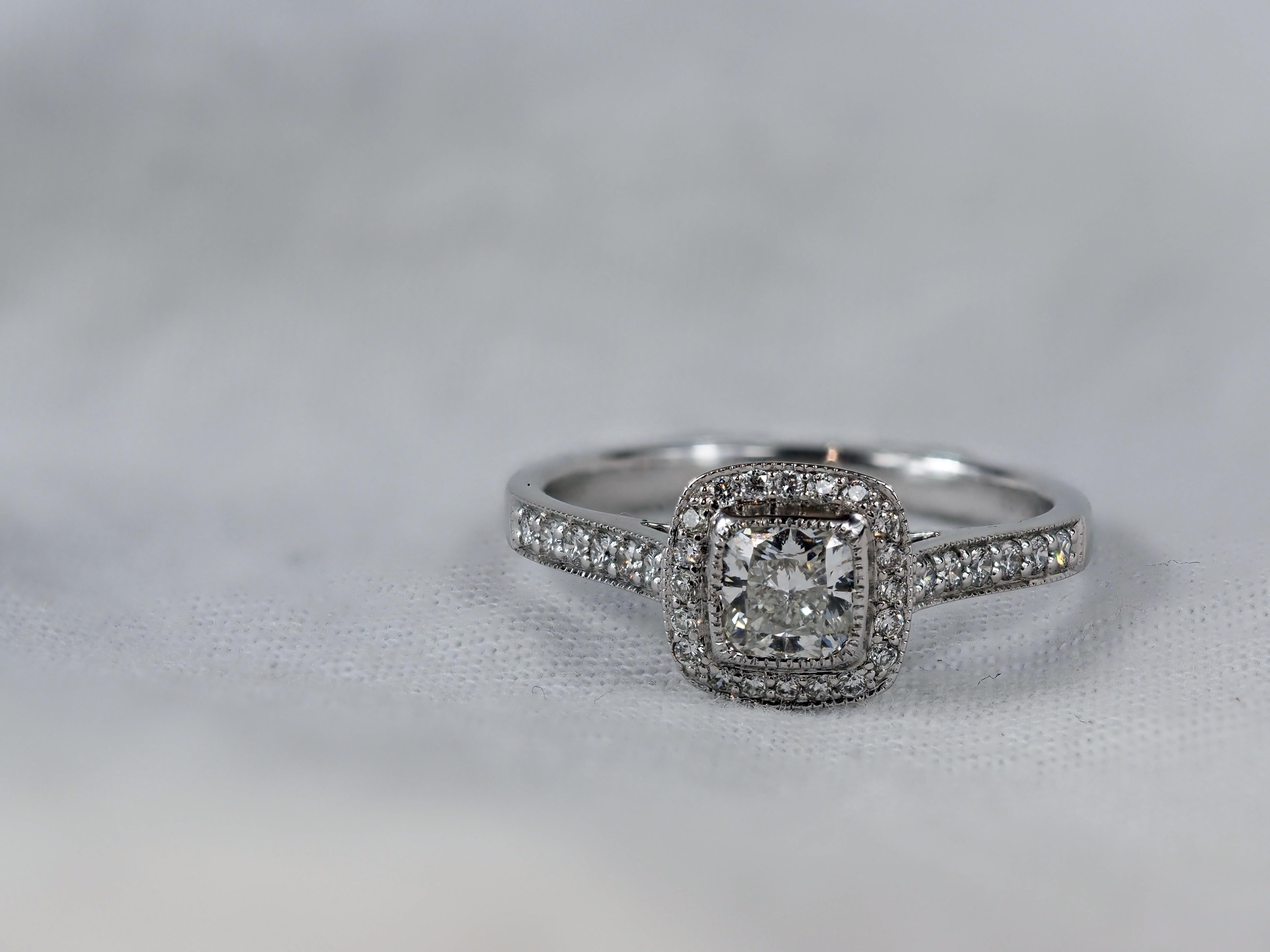 18 Carat White Gold Cushion Halo Engagement Ring, 0.72 carats.