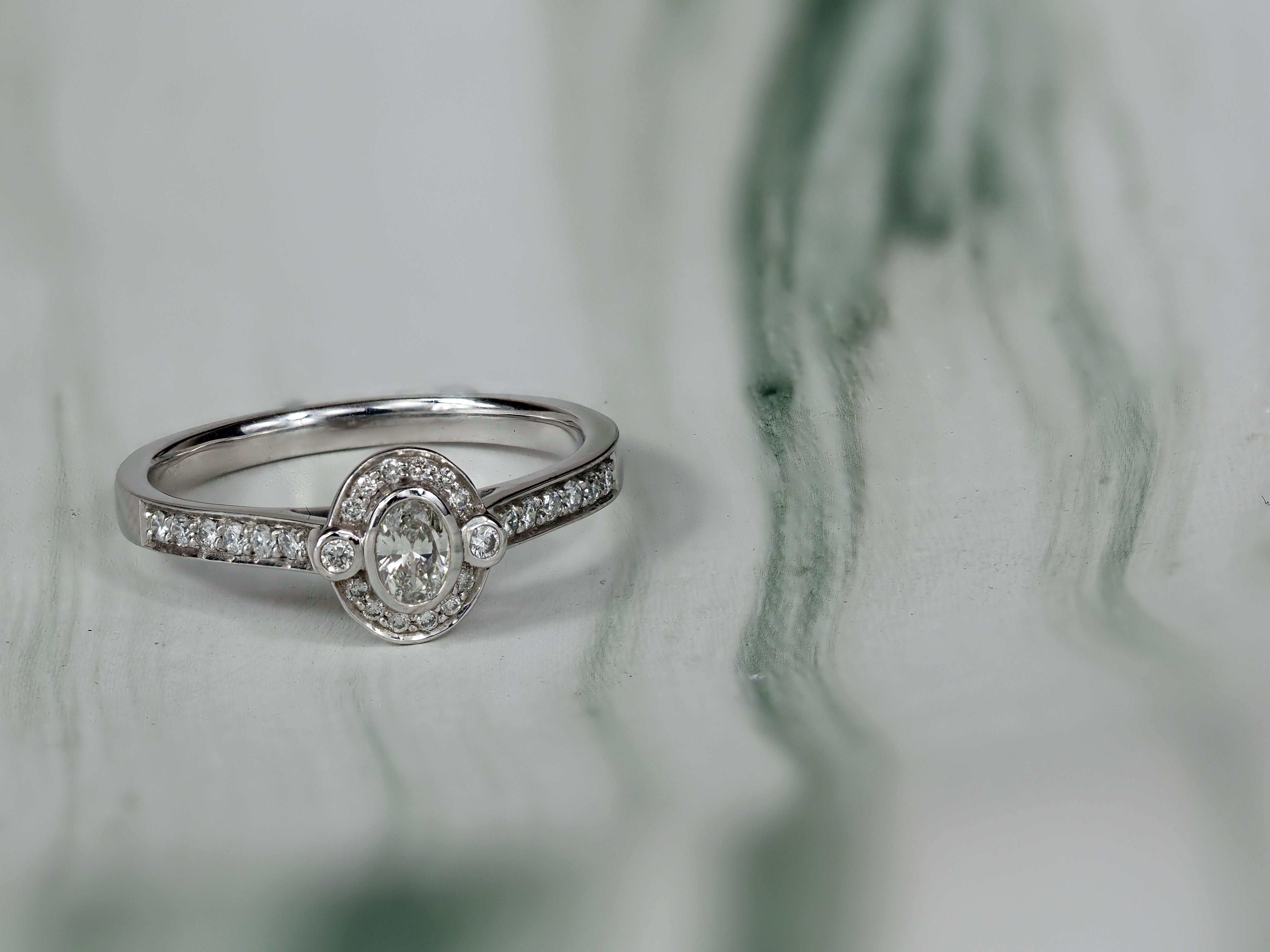18ct White Gold Oval Cut Diamond Halo Engagement Ring, 0.15ct Centre