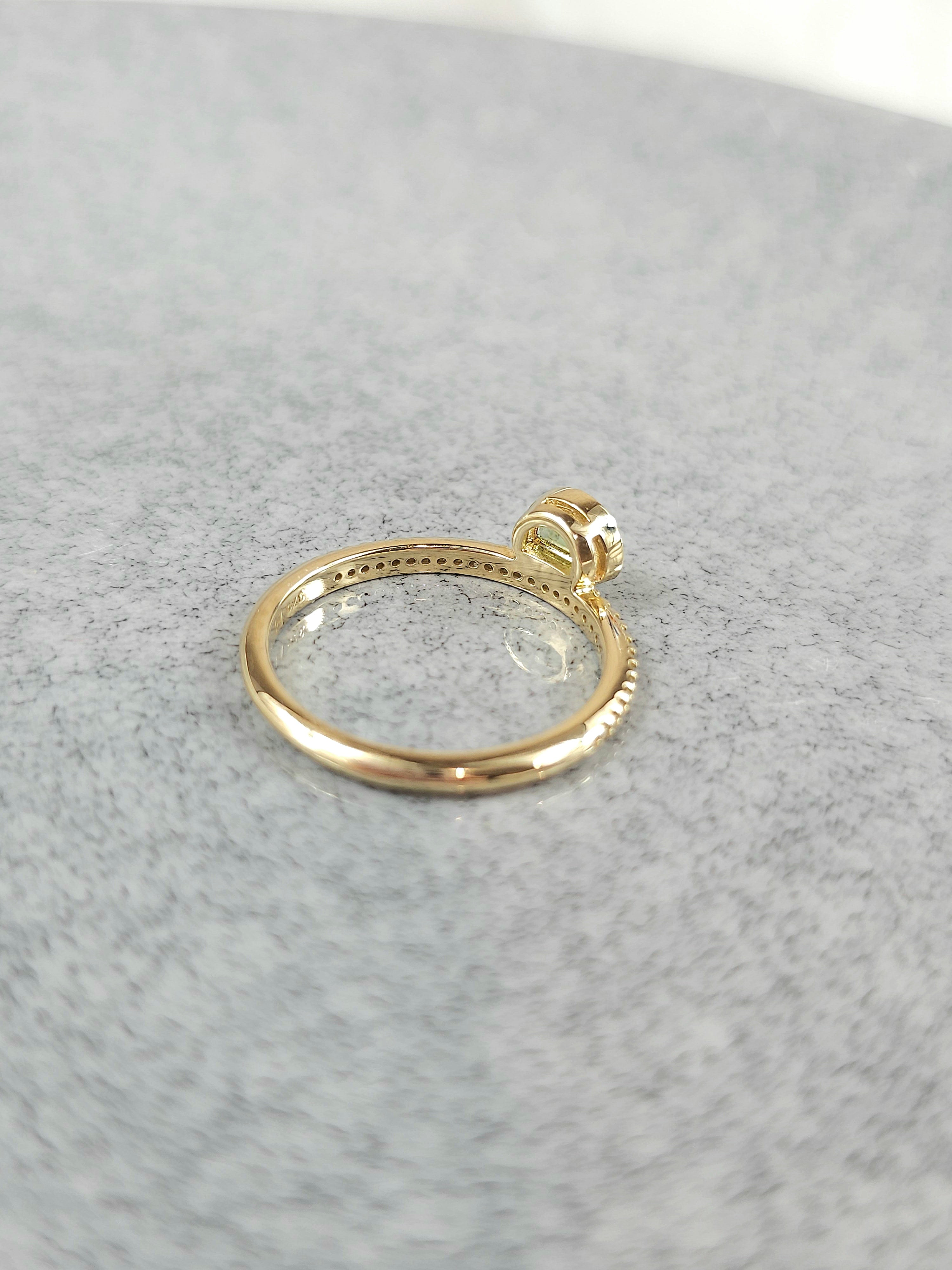 9ct Yellow Gold Peridot and Diamond Ring, 0.27ct centre