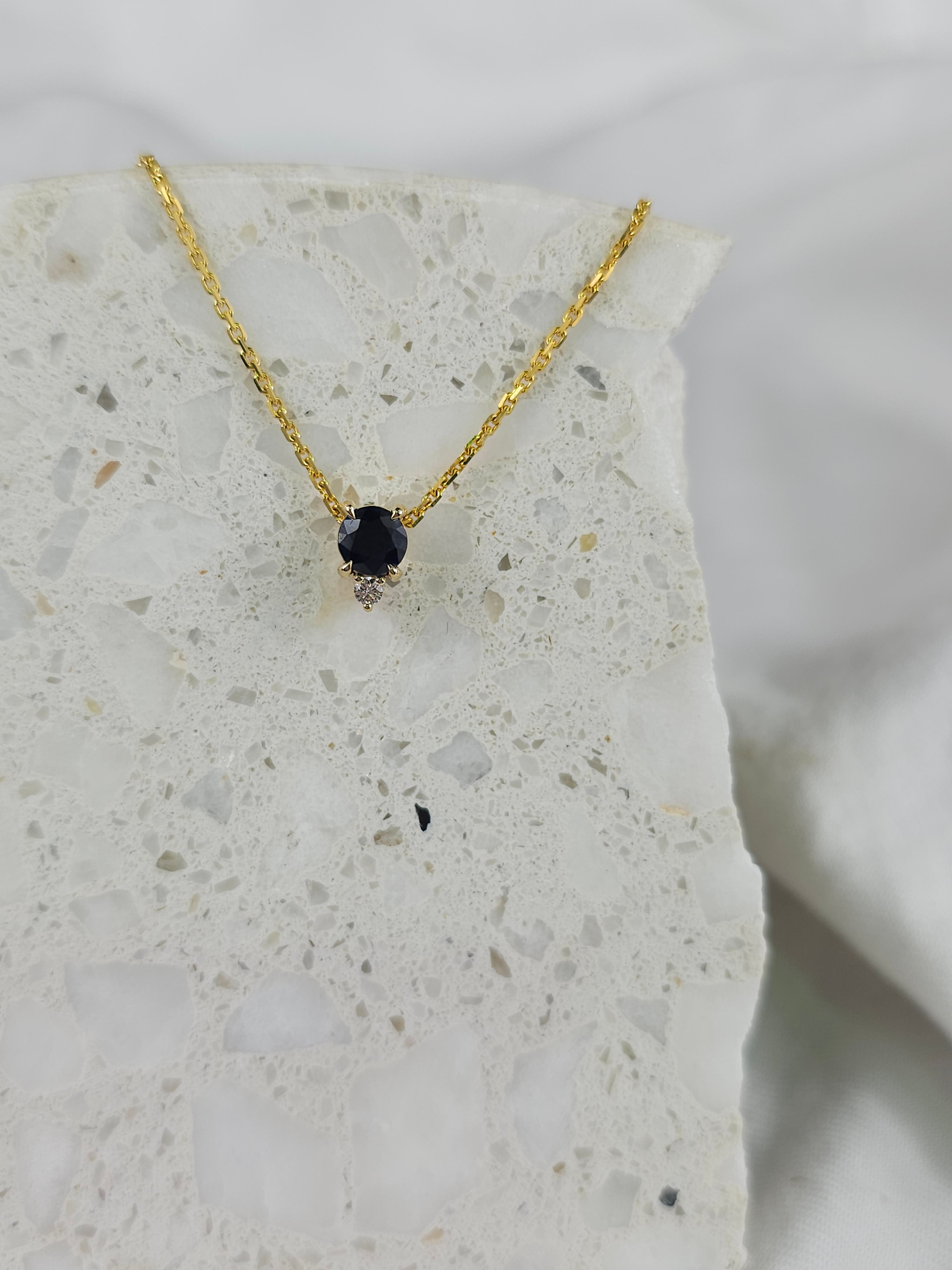 9ct Yellow Gold Sapphire and Diamond pendant, 0.69ct centre