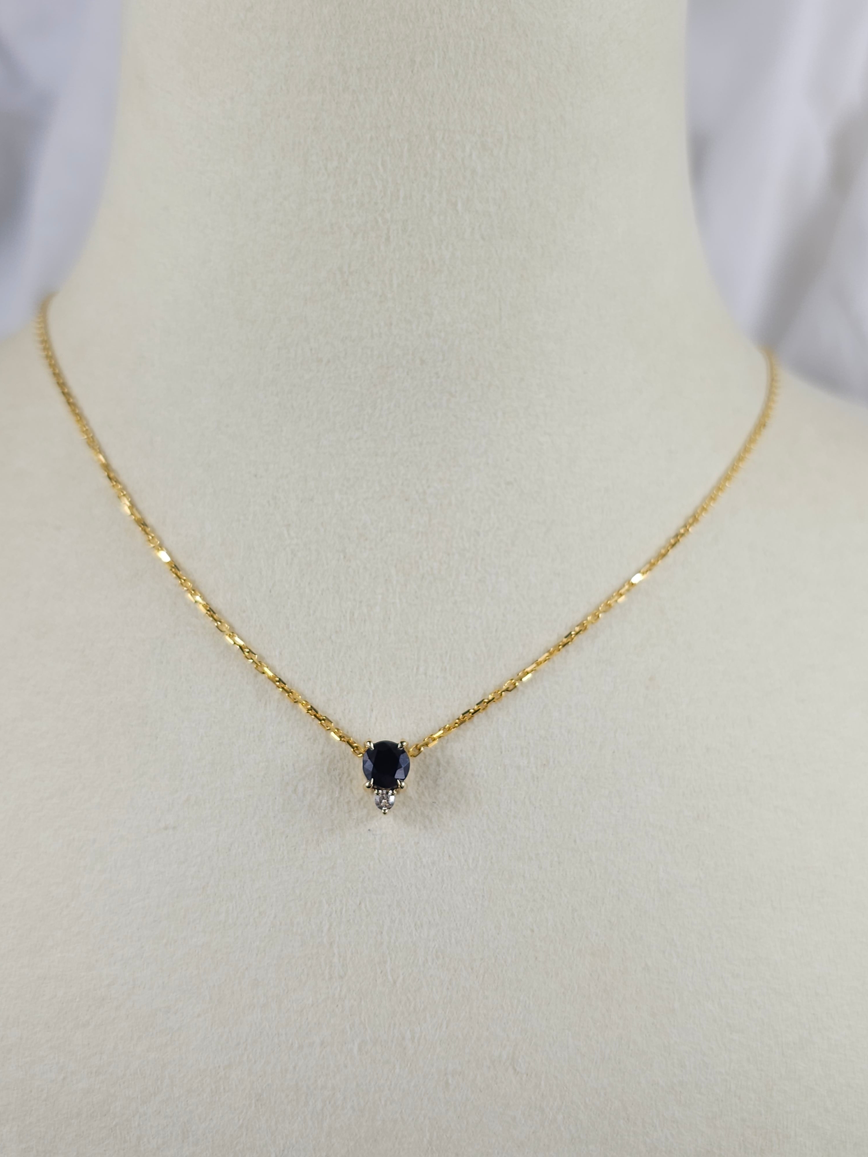 9ct Yellow Gold Sapphire and Diamond pendant, 0.69ct centre