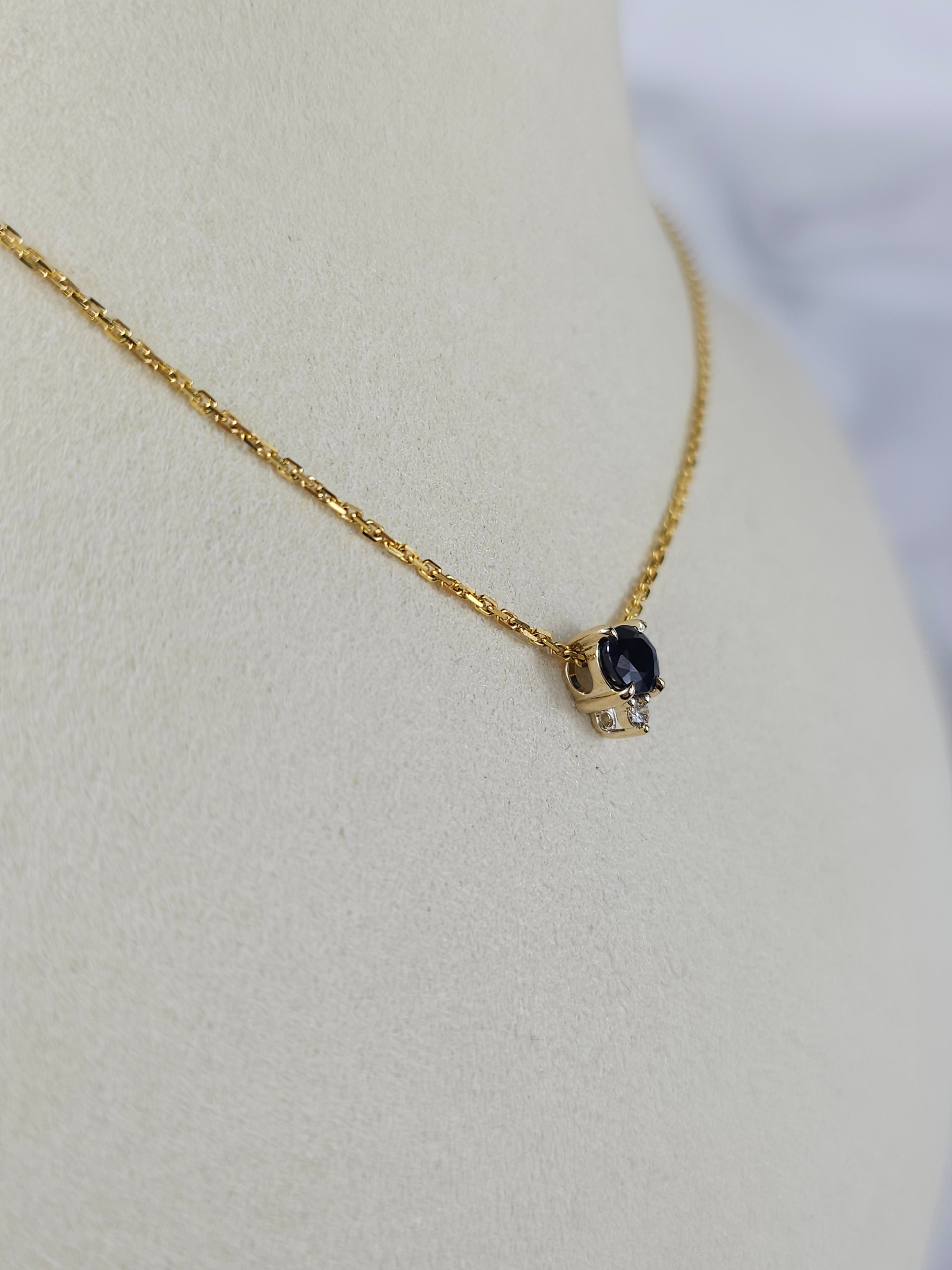 9ct Yellow Gold Sapphire and Diamond pendant, 0.69ct centre