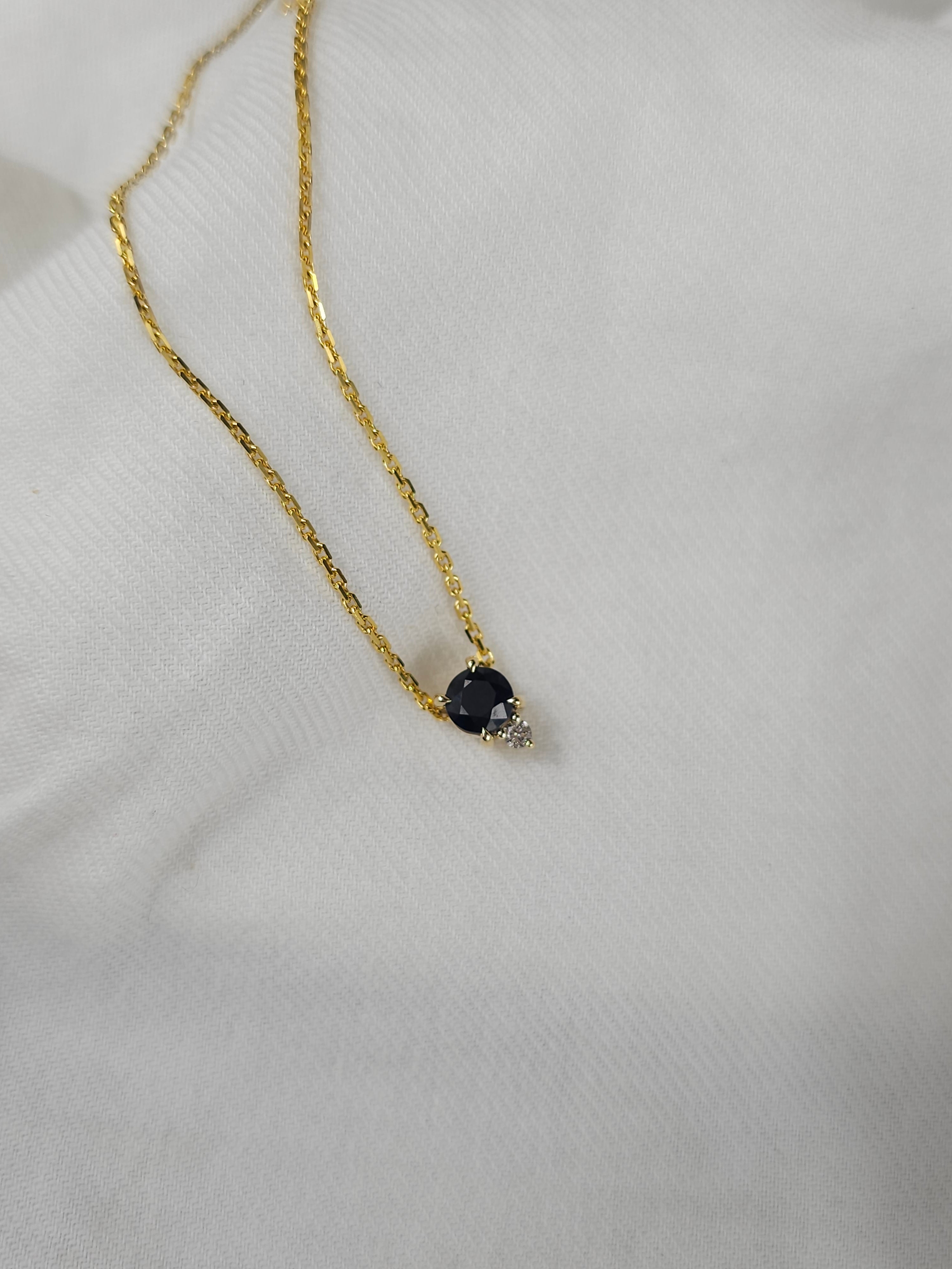 9ct Yellow Gold Sapphire and Diamond pendant, 0.69ct centre
