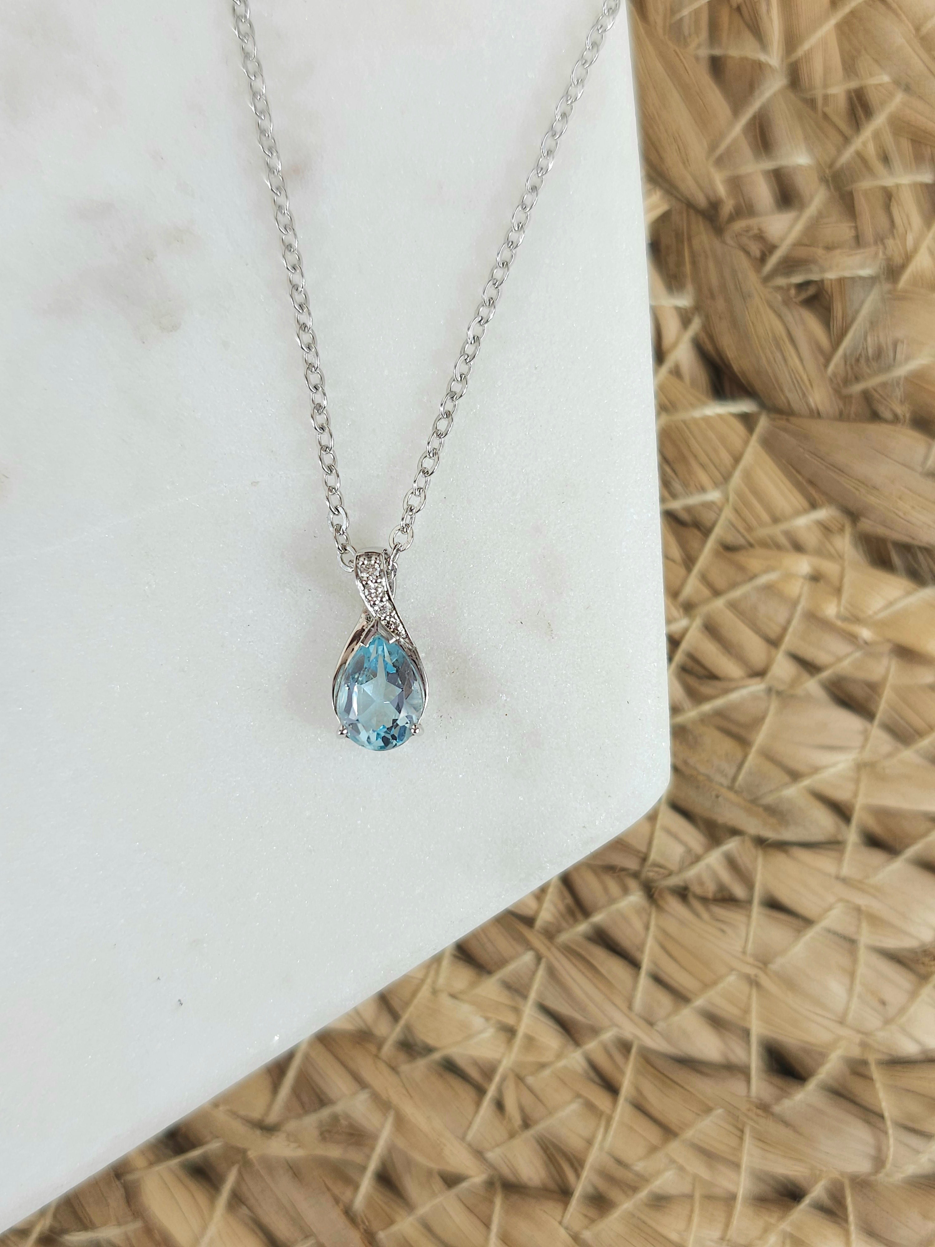 9ct White Gold Blue Topaz and Diamond pendant