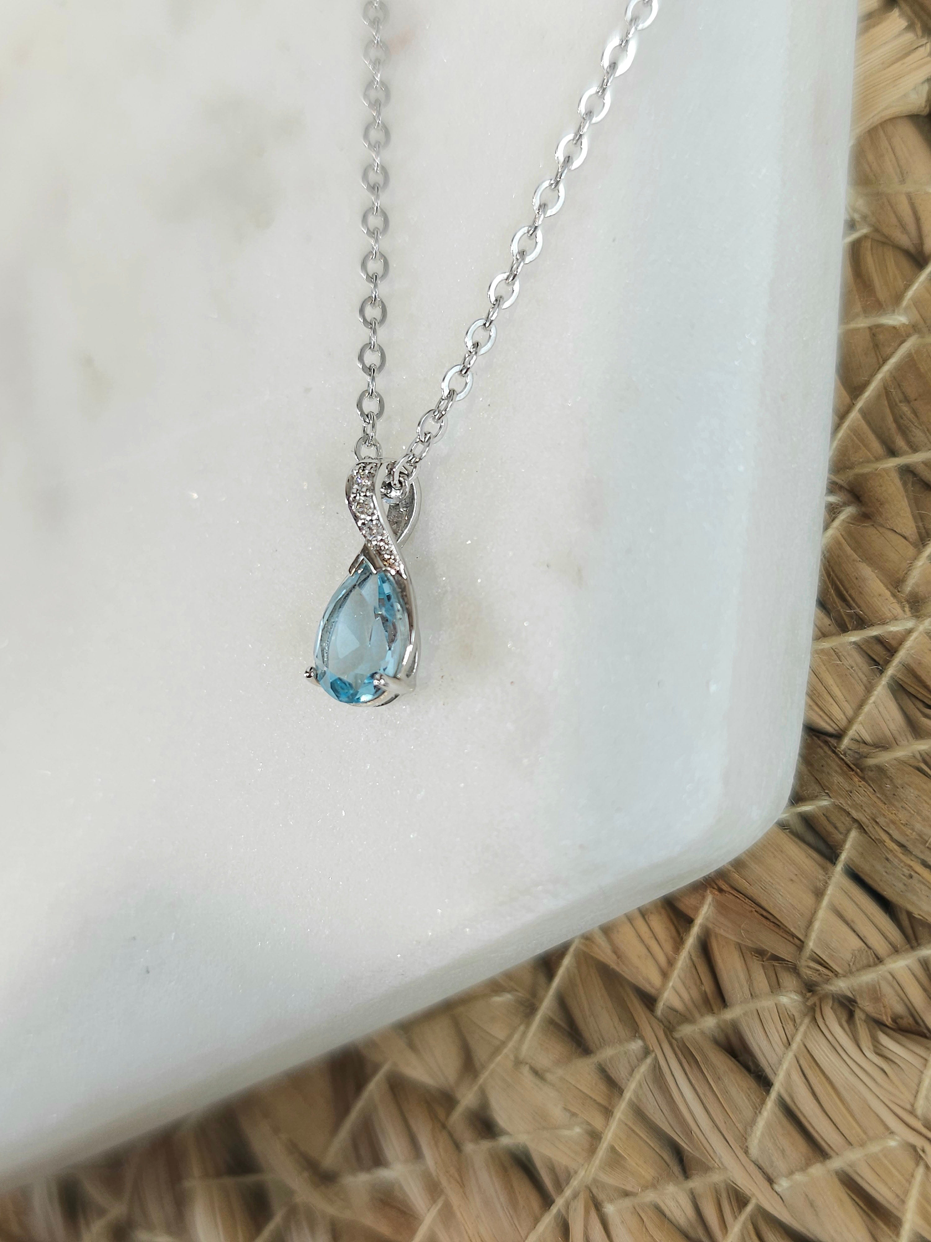 9ct White Gold Blue Topaz and Diamond pendant