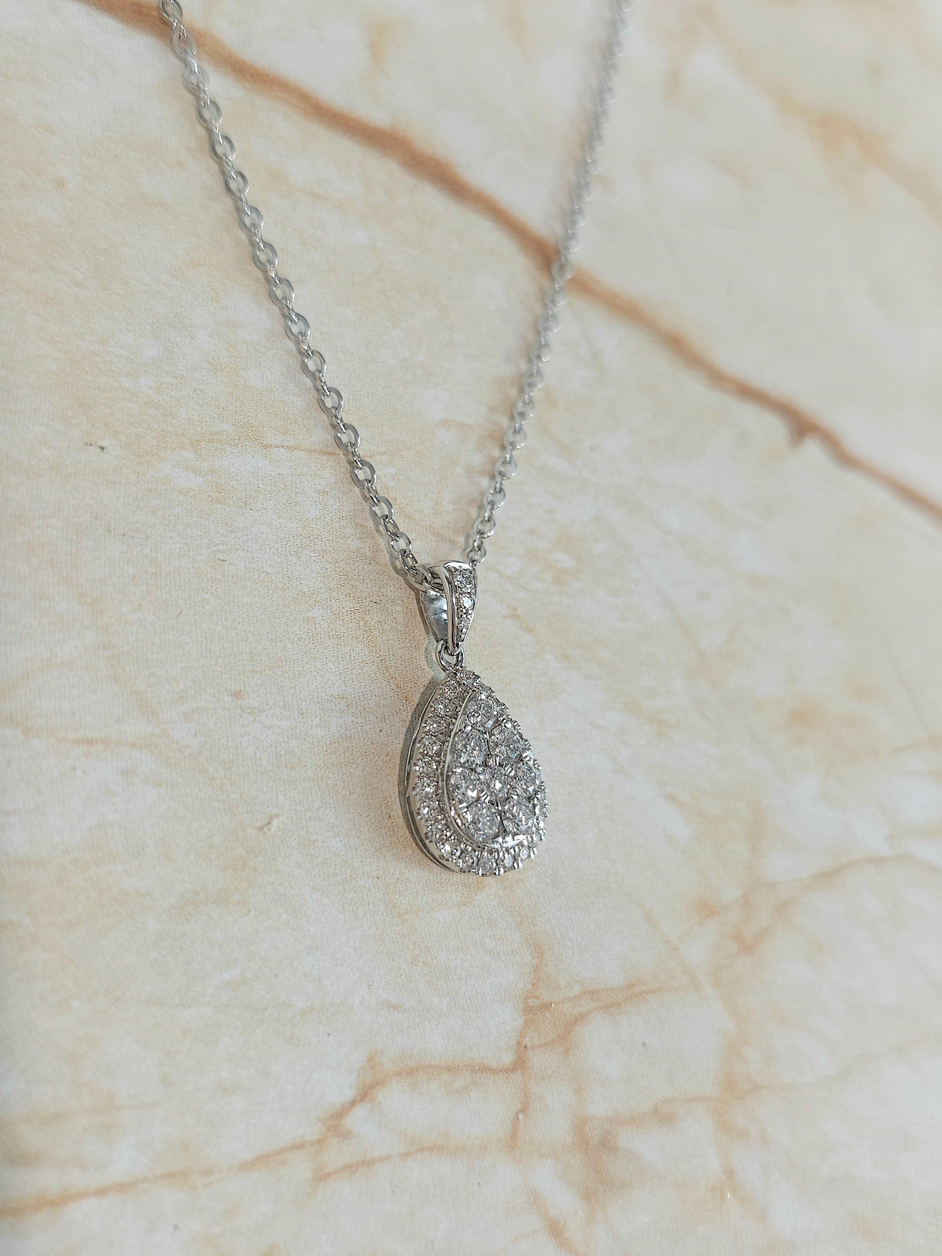 9ct White Gold Pear Shaped cluster Diamond pendant, equaling 0.52ct