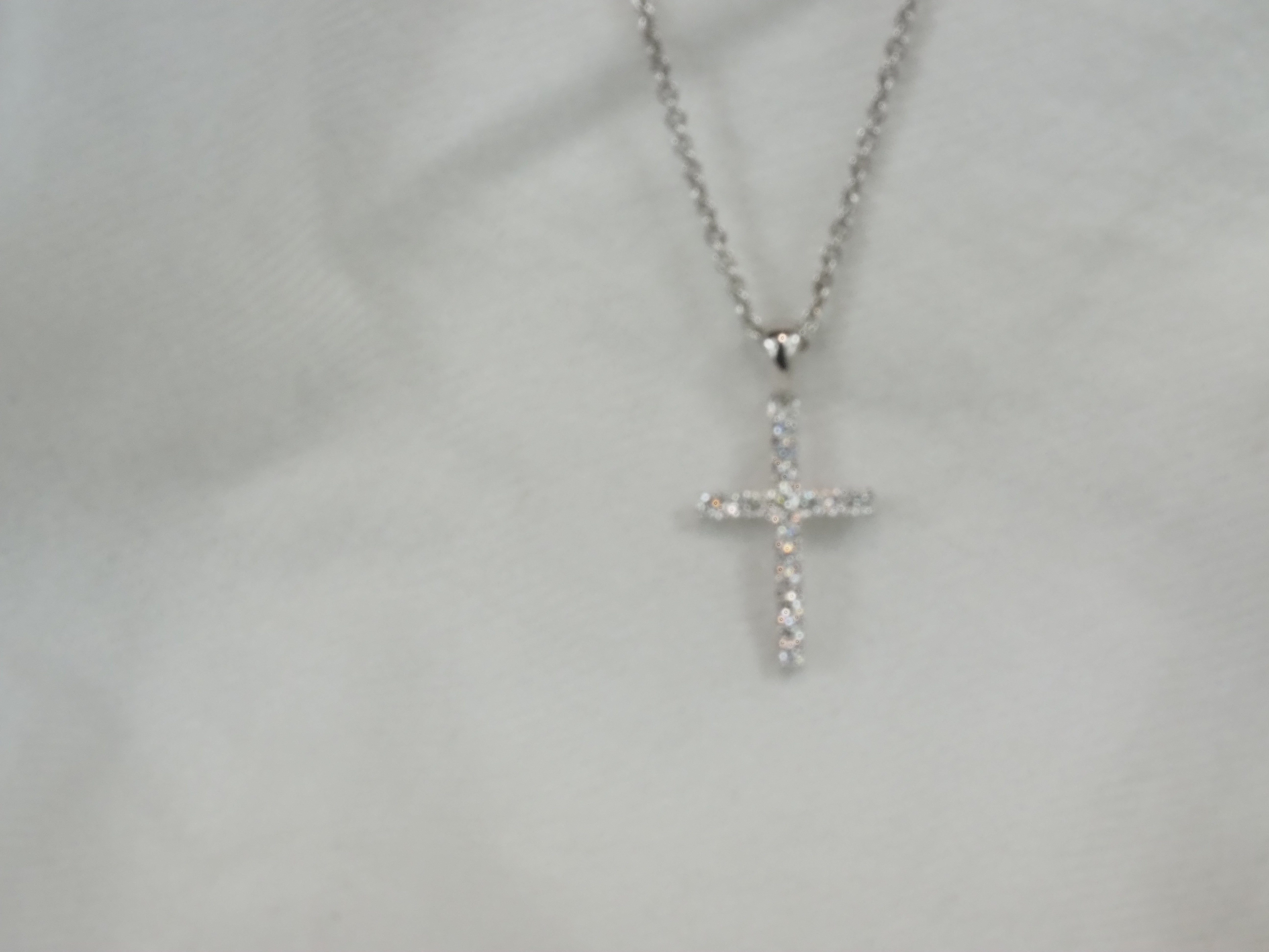 9ct White Gold Claw set Diamond cross, 0.15ct total