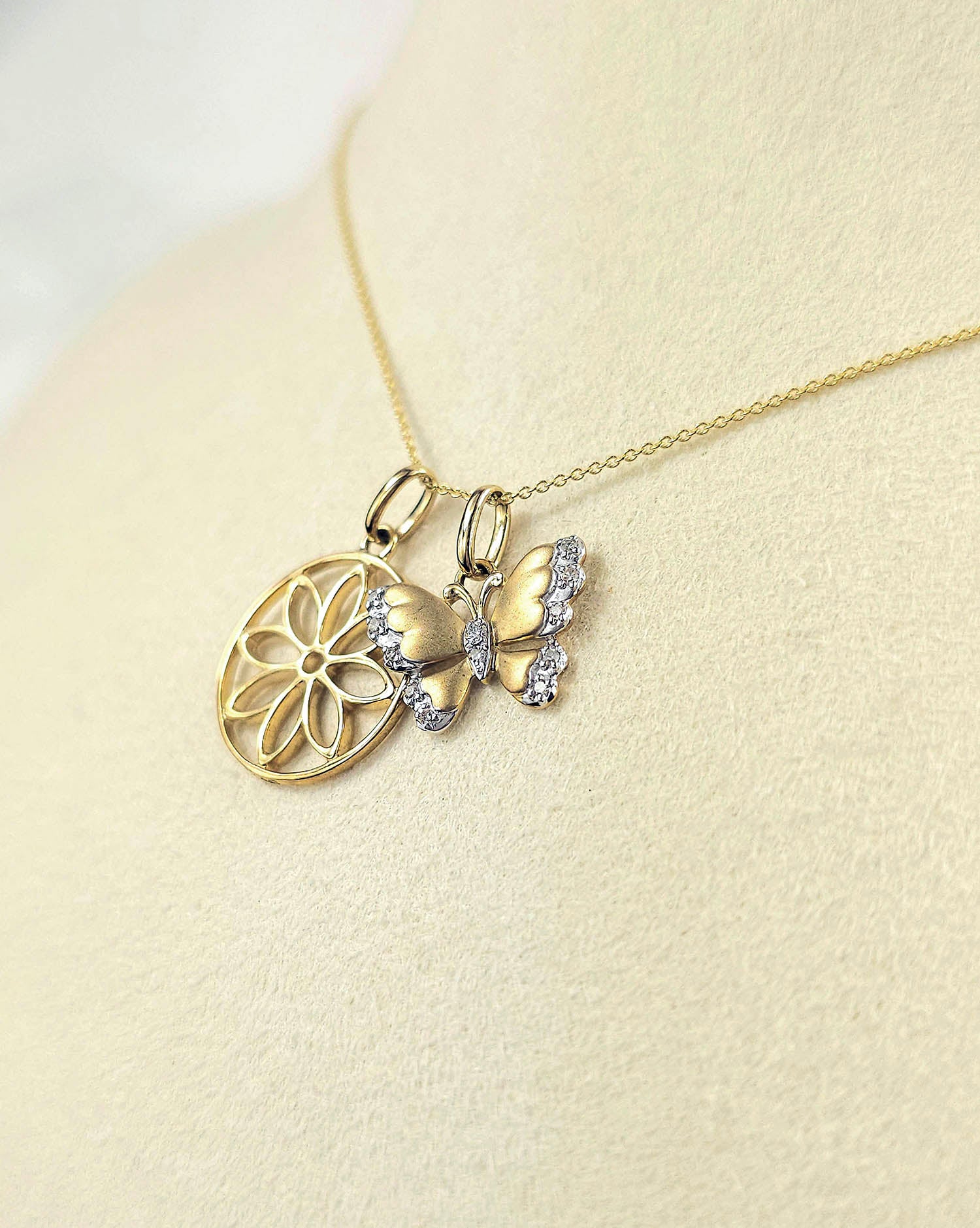 9ct Yellow and White Gold Diamond set Butterfly pendant and cut out flower pendant