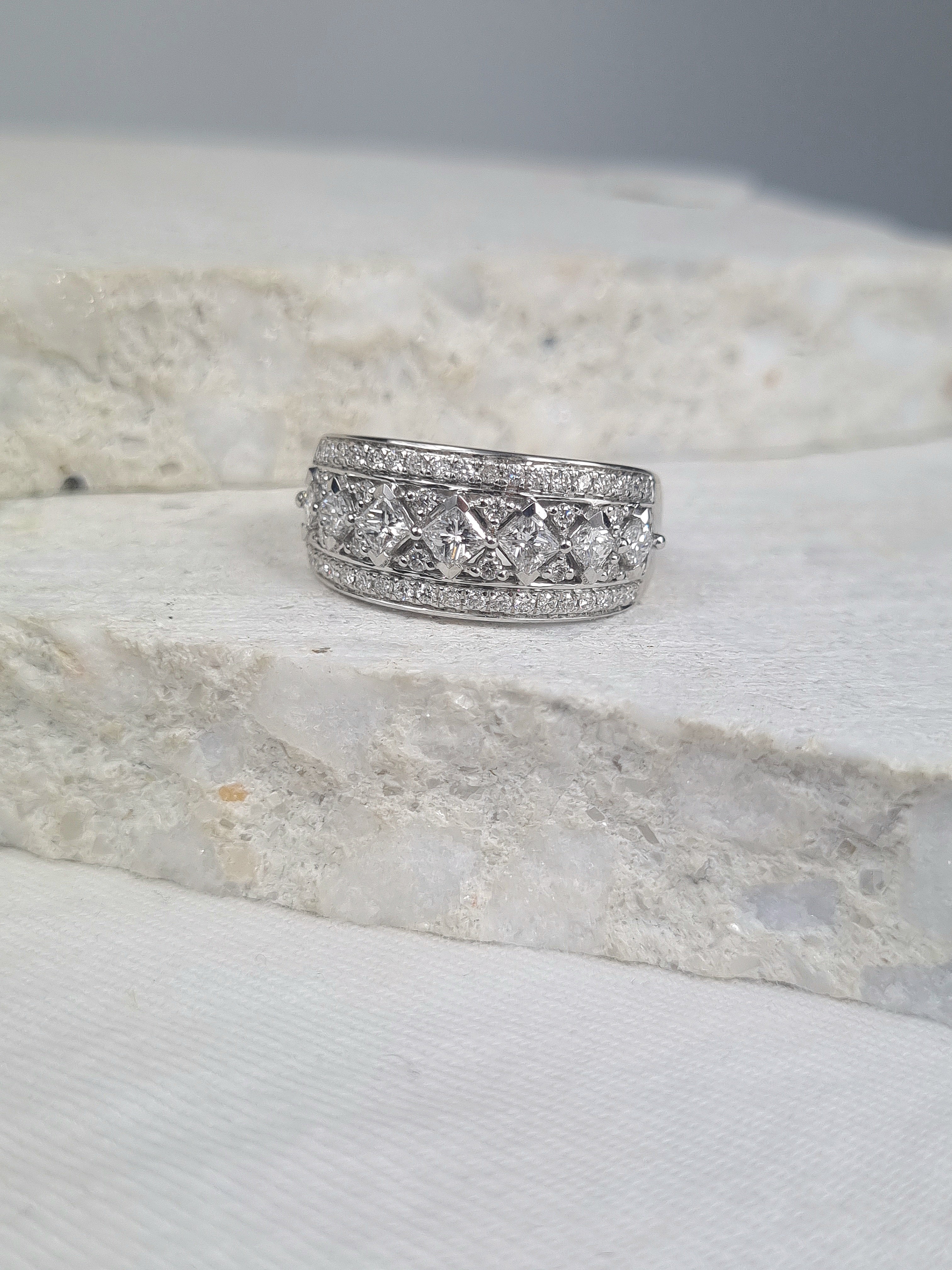 18 Carat White Gold Wide Princess Cut Ring, 1.04 Carats Total.