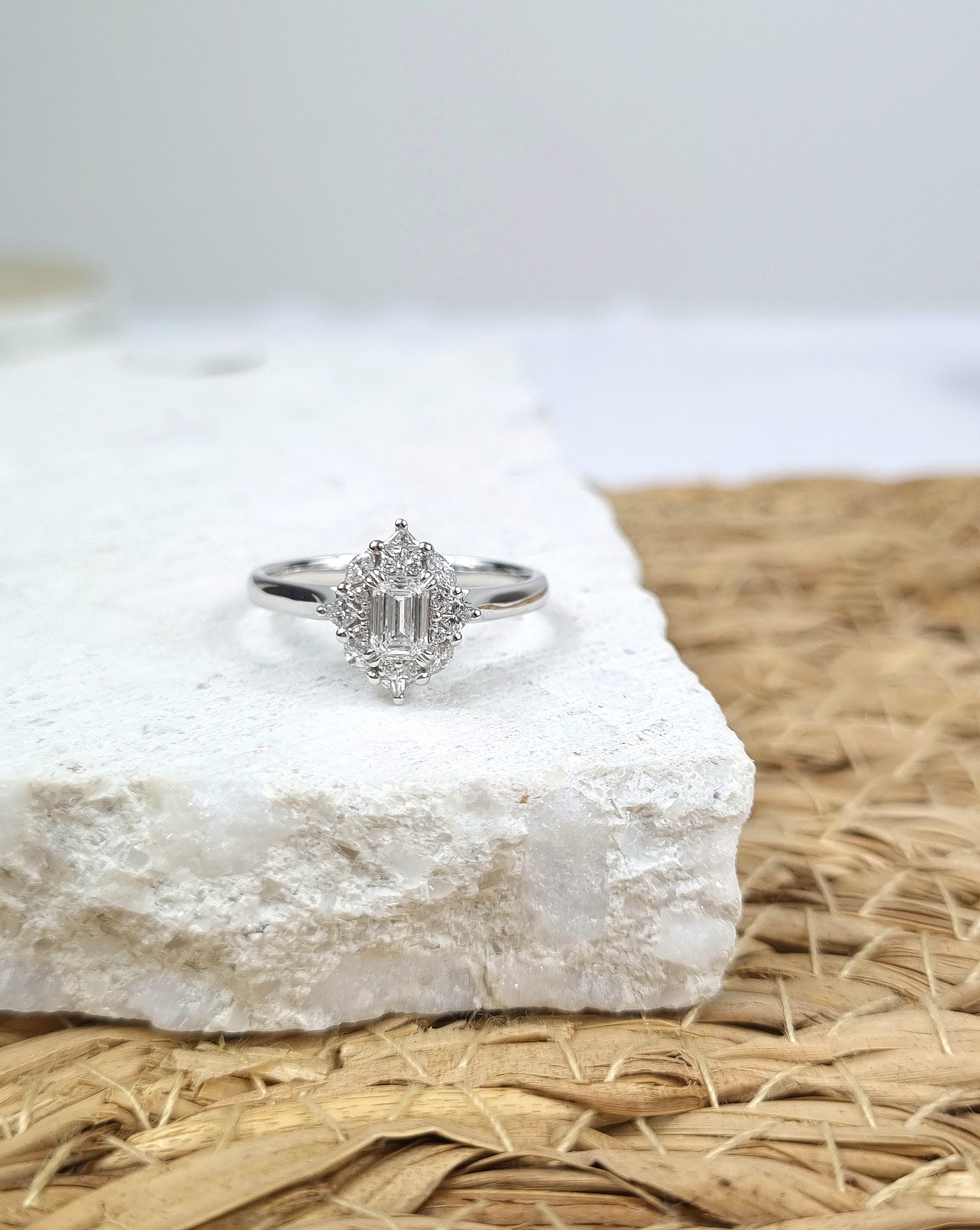 18ct Gold Emerald Cut Halo Diamond Ring, 0.61 carats.