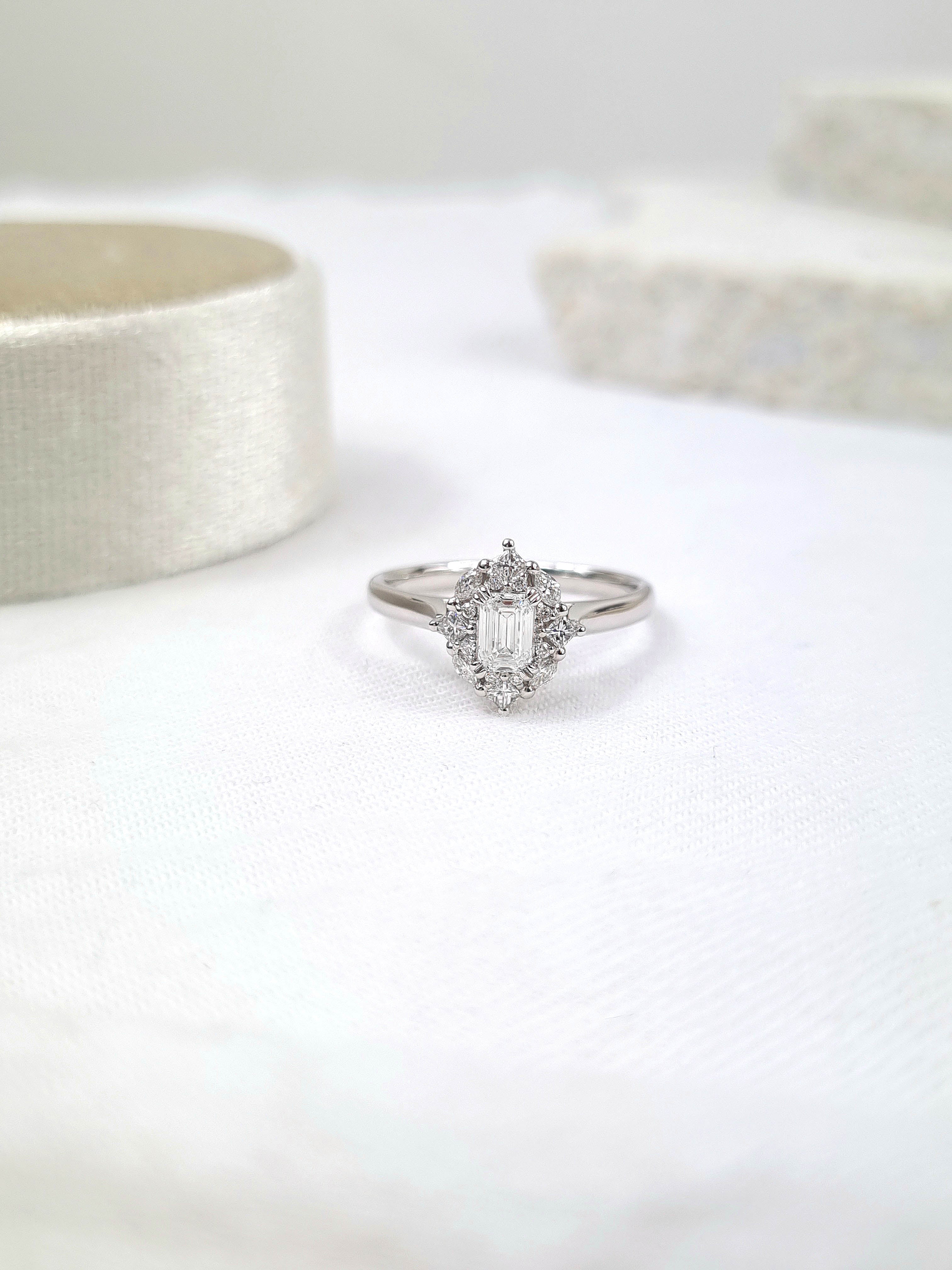 18ct Gold Emerald Cut Halo Diamond Ring, 0.61 carats.