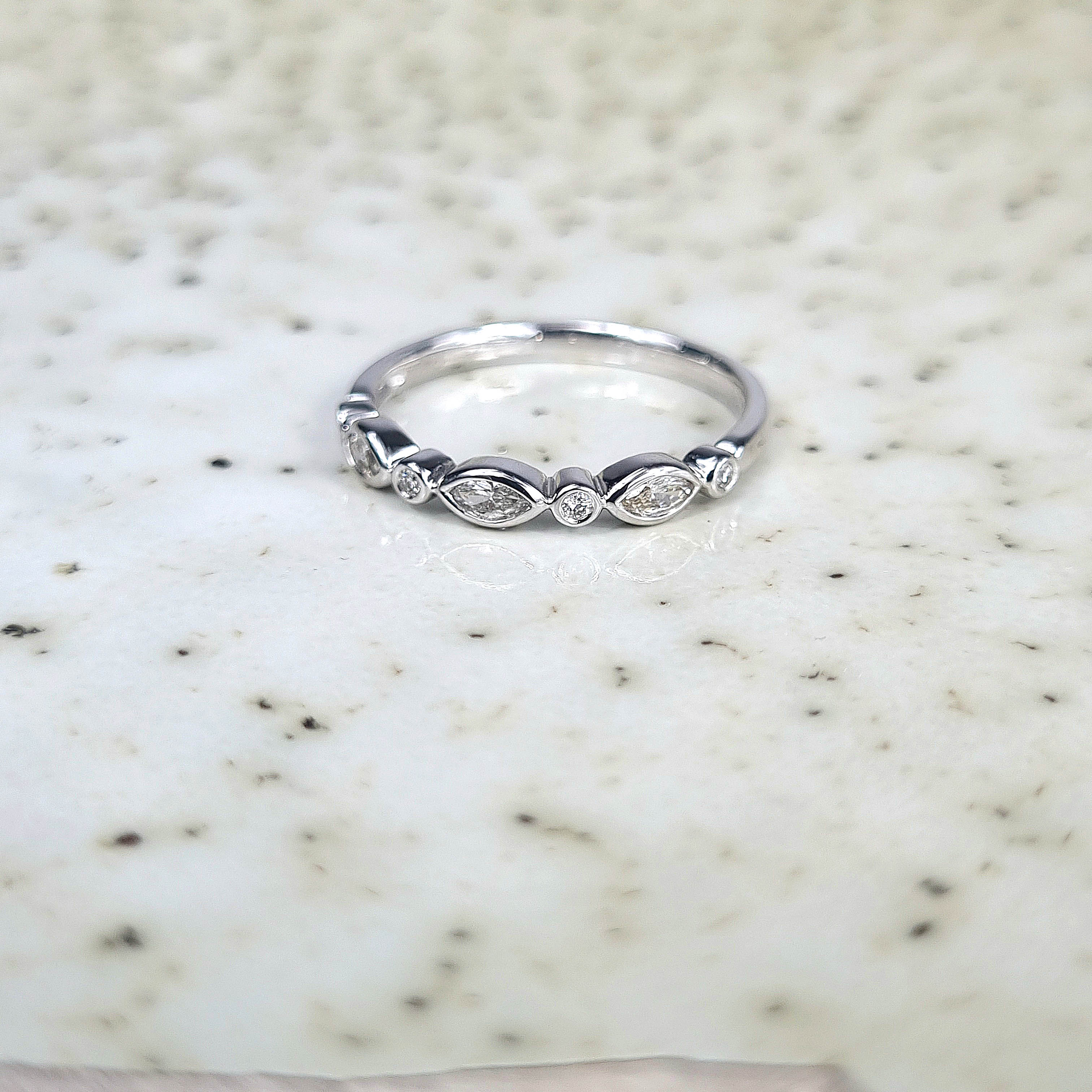 18ct White Gold Round and Marquis Diamond Band, 0.20ct total