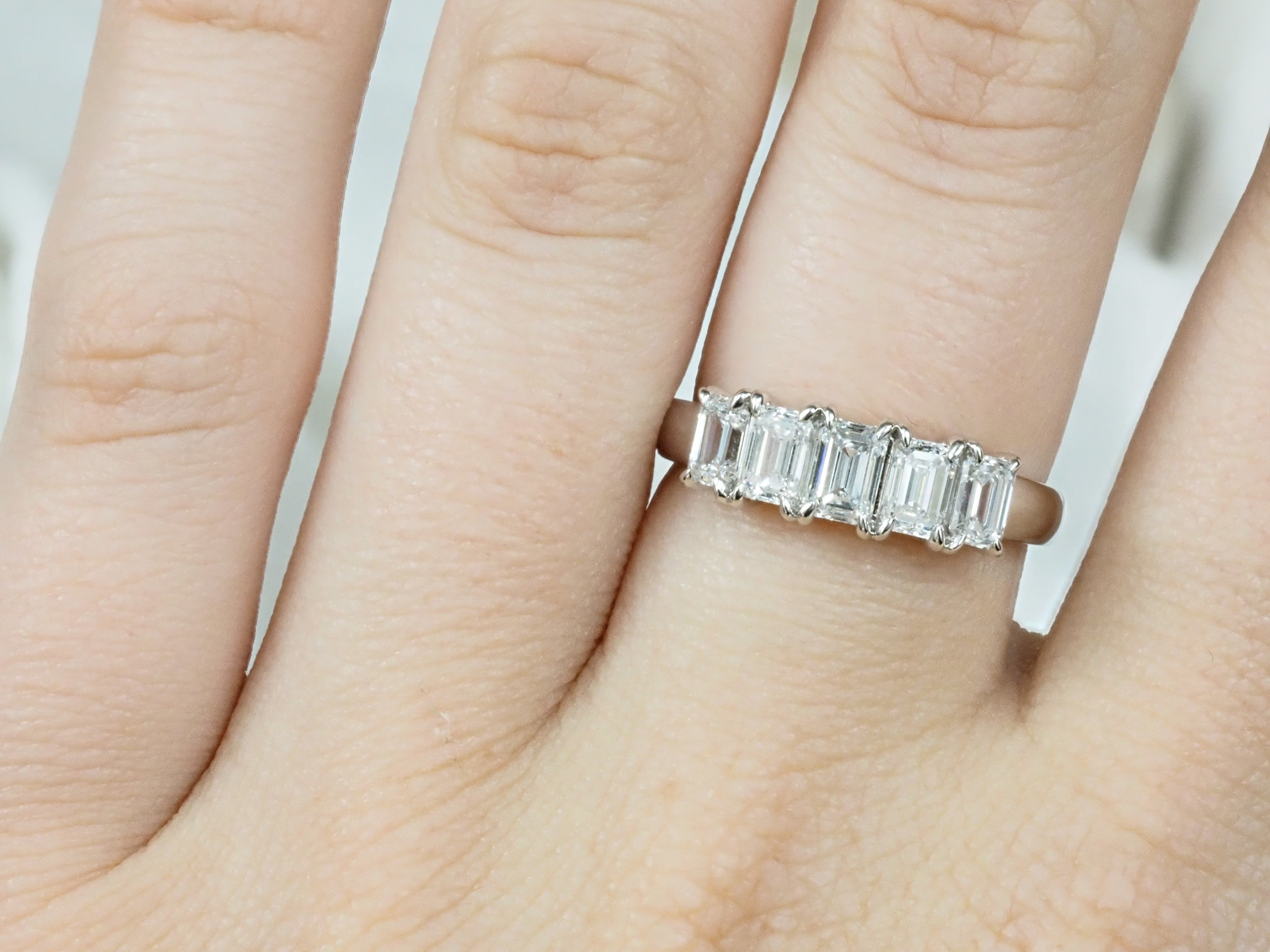 14 Carat White Gold, 5 Emerald-cut Lab-grown Ring, 1.51 carats total.