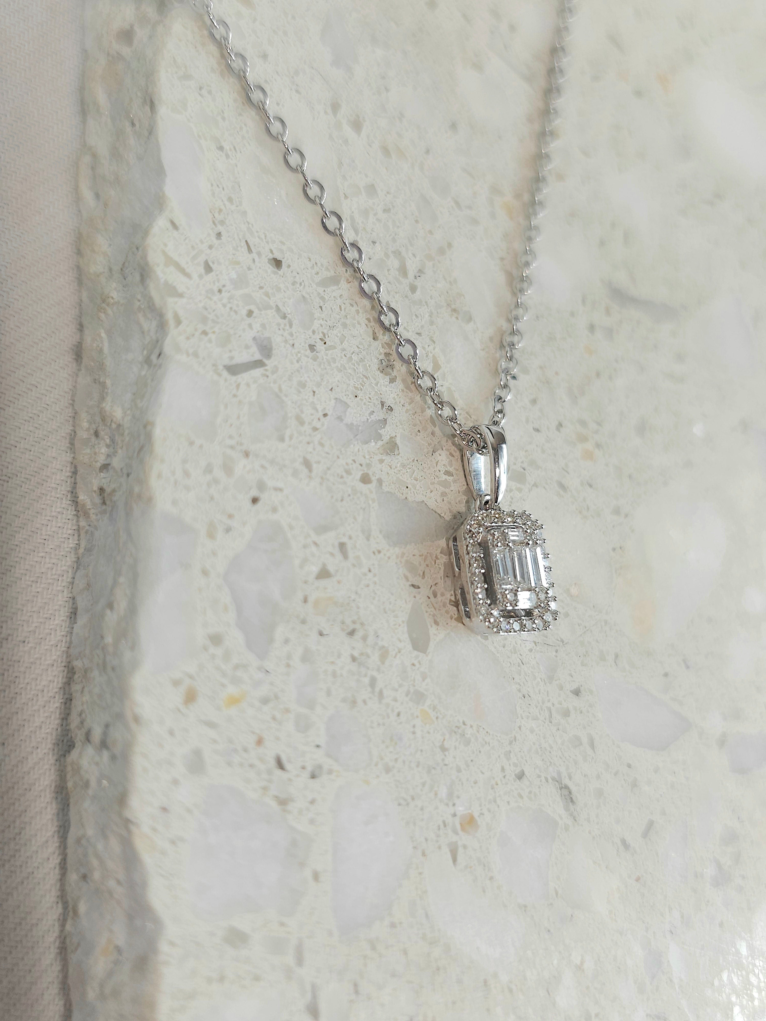 9ct White Gold Baguette & Round Diamond Pendant, 0.18ct total.