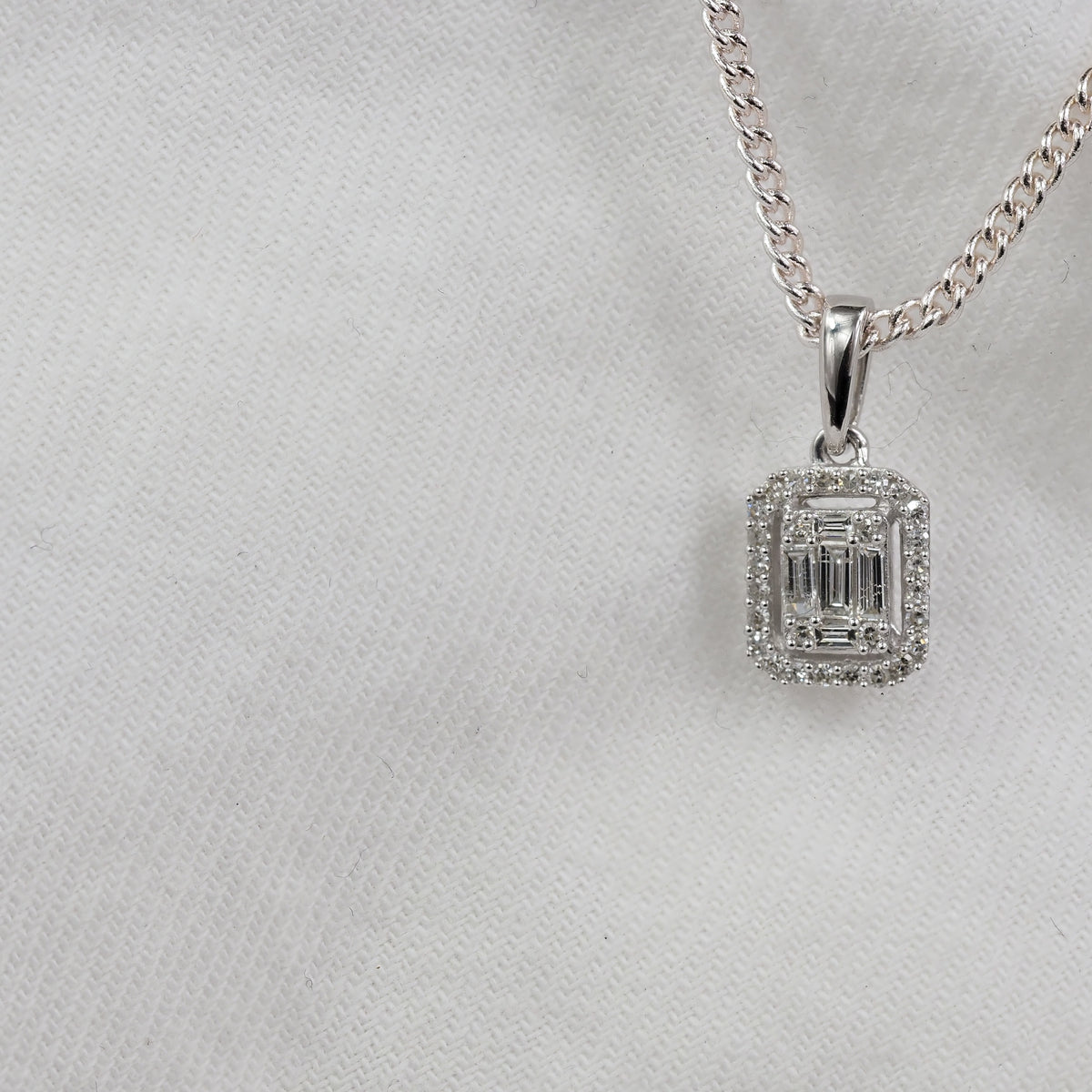 9ct White Gold Baguette & Round Diamond Pendant, 0.18ct total.