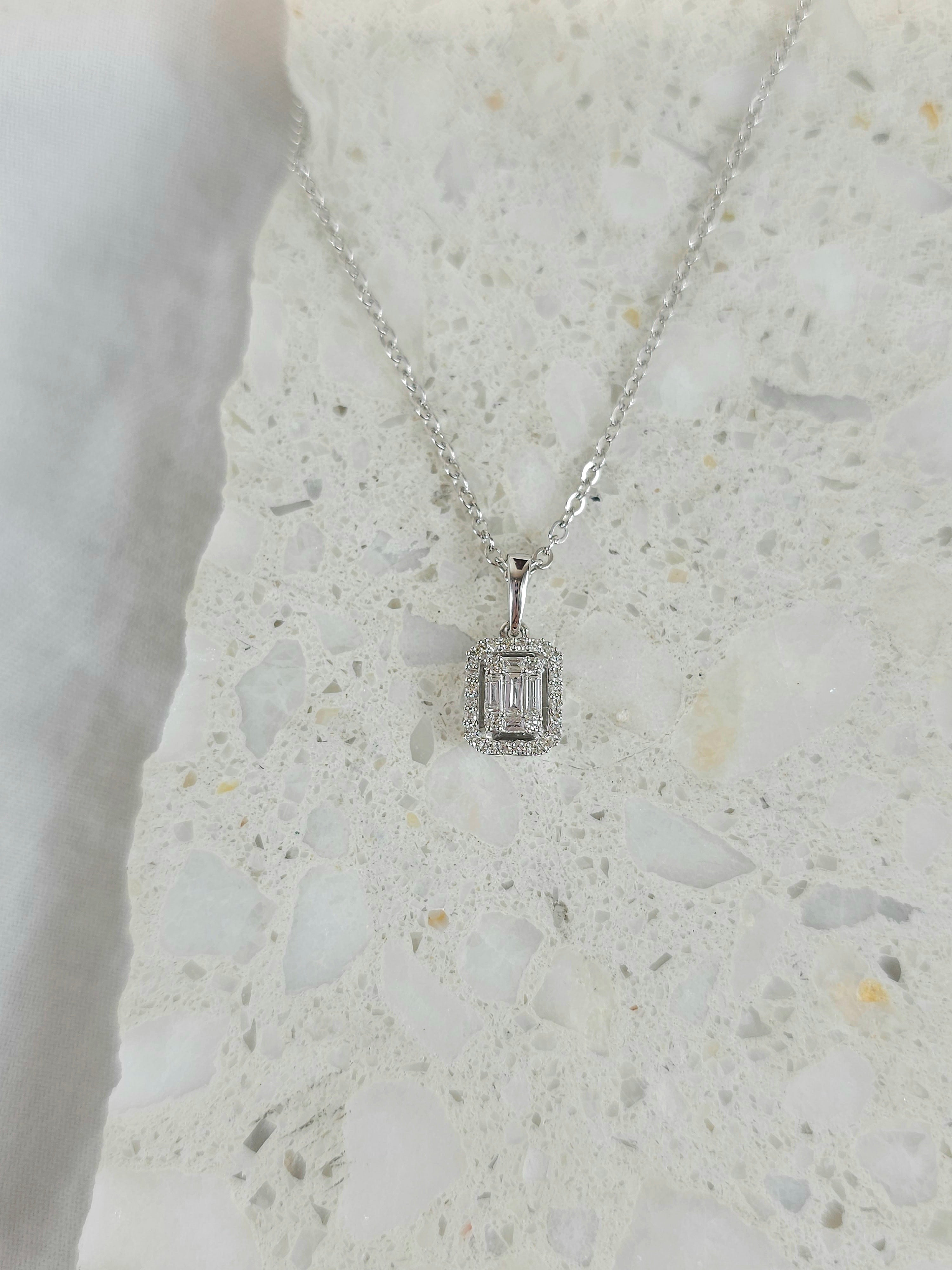 9ct White Gold Baguette & Round Diamond Pendant, 0.18ct total.