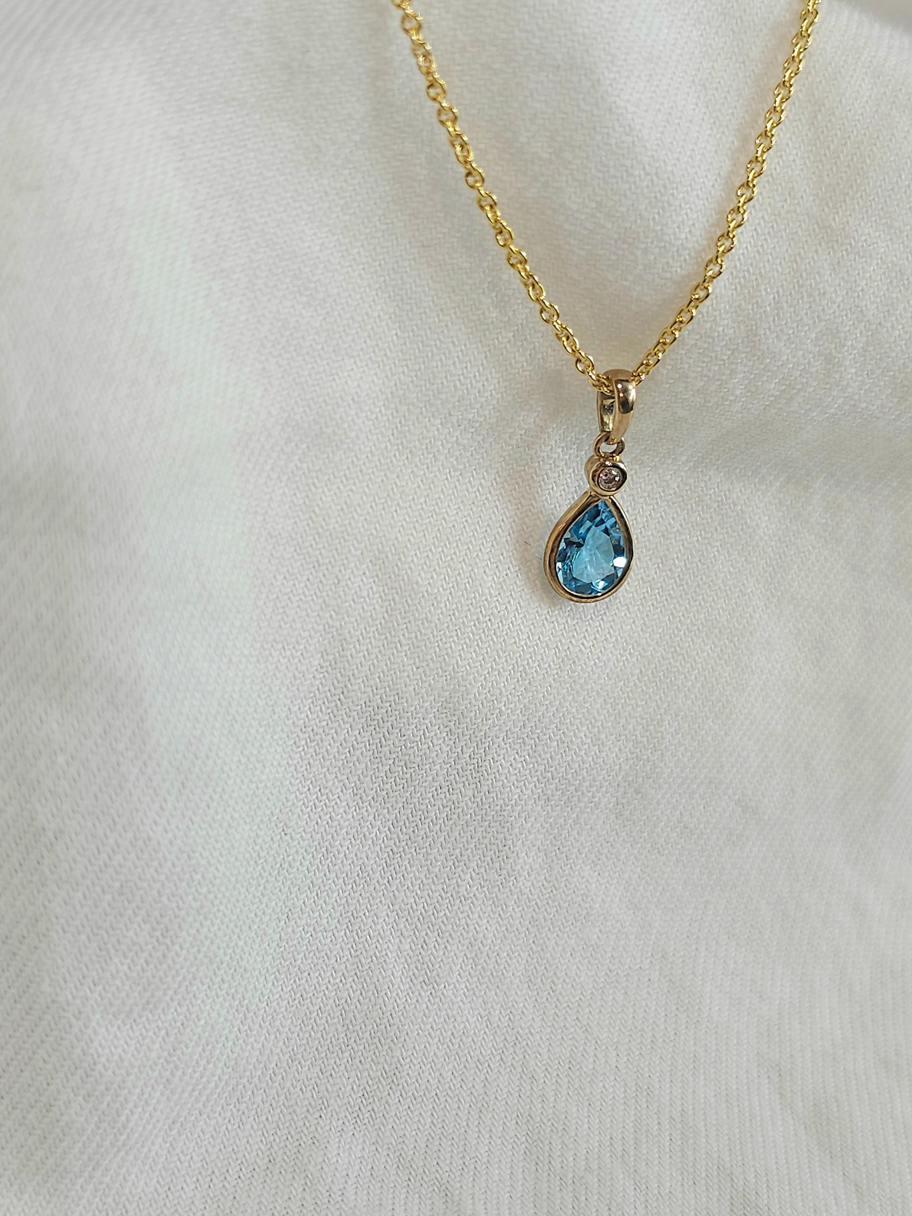 9ct blue topaz & cubic zirconia pendant