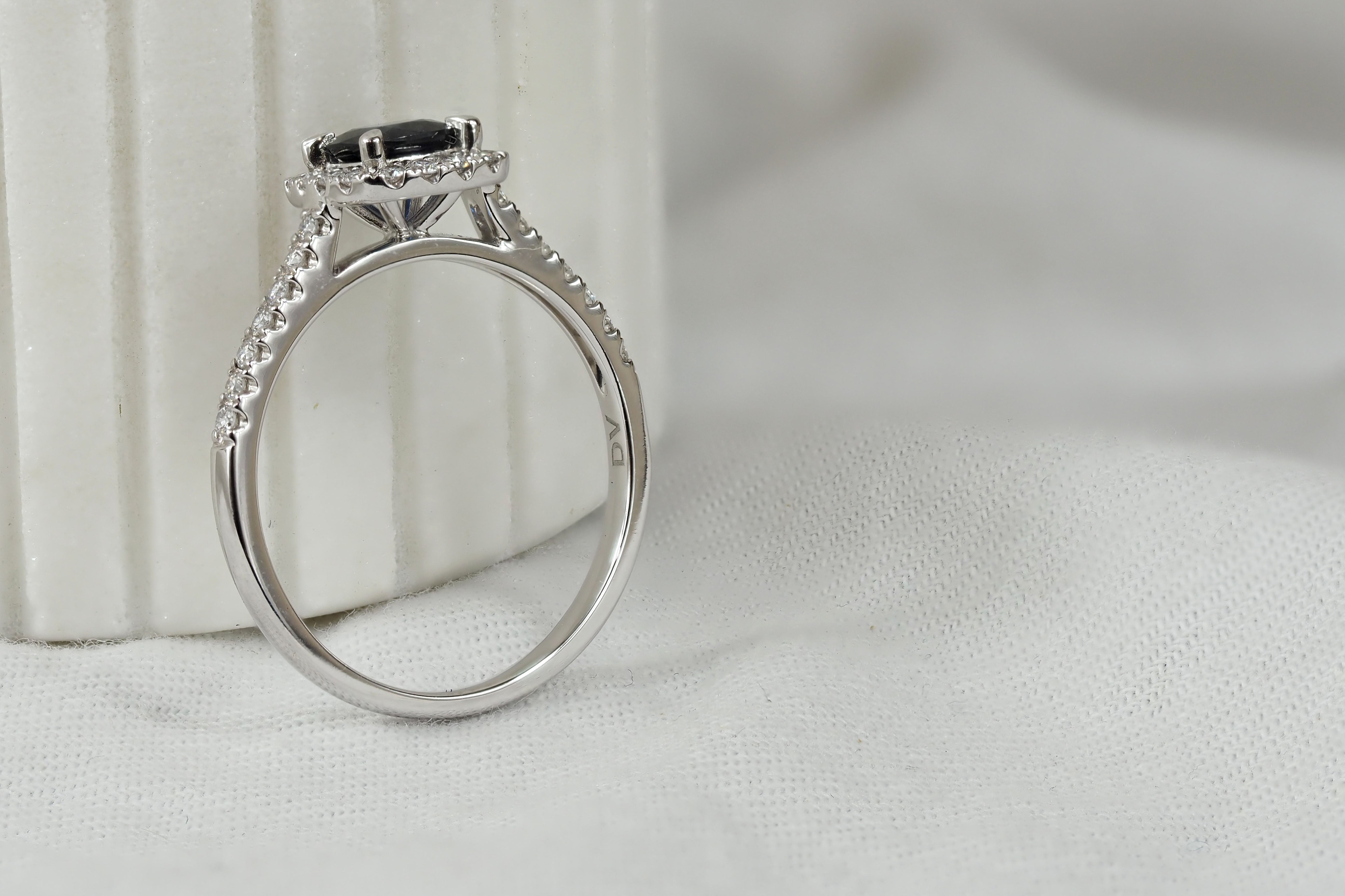 18ct White Gold Sapphire and Diamond ring, 0.56ct centre