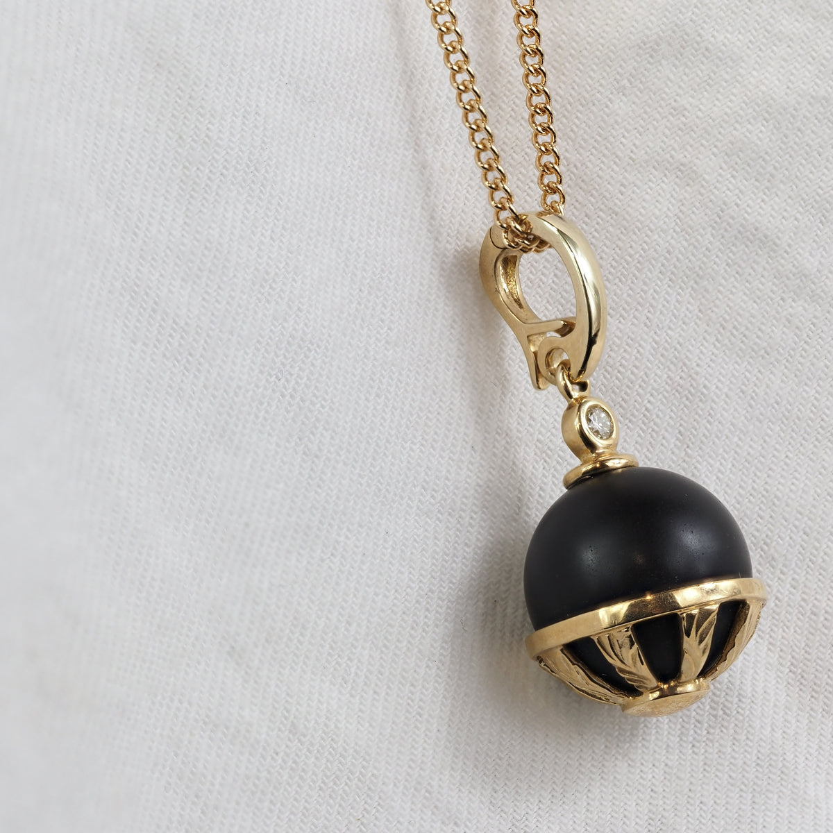 9ct Yellow Gold Round Onyx and Diamond pendant