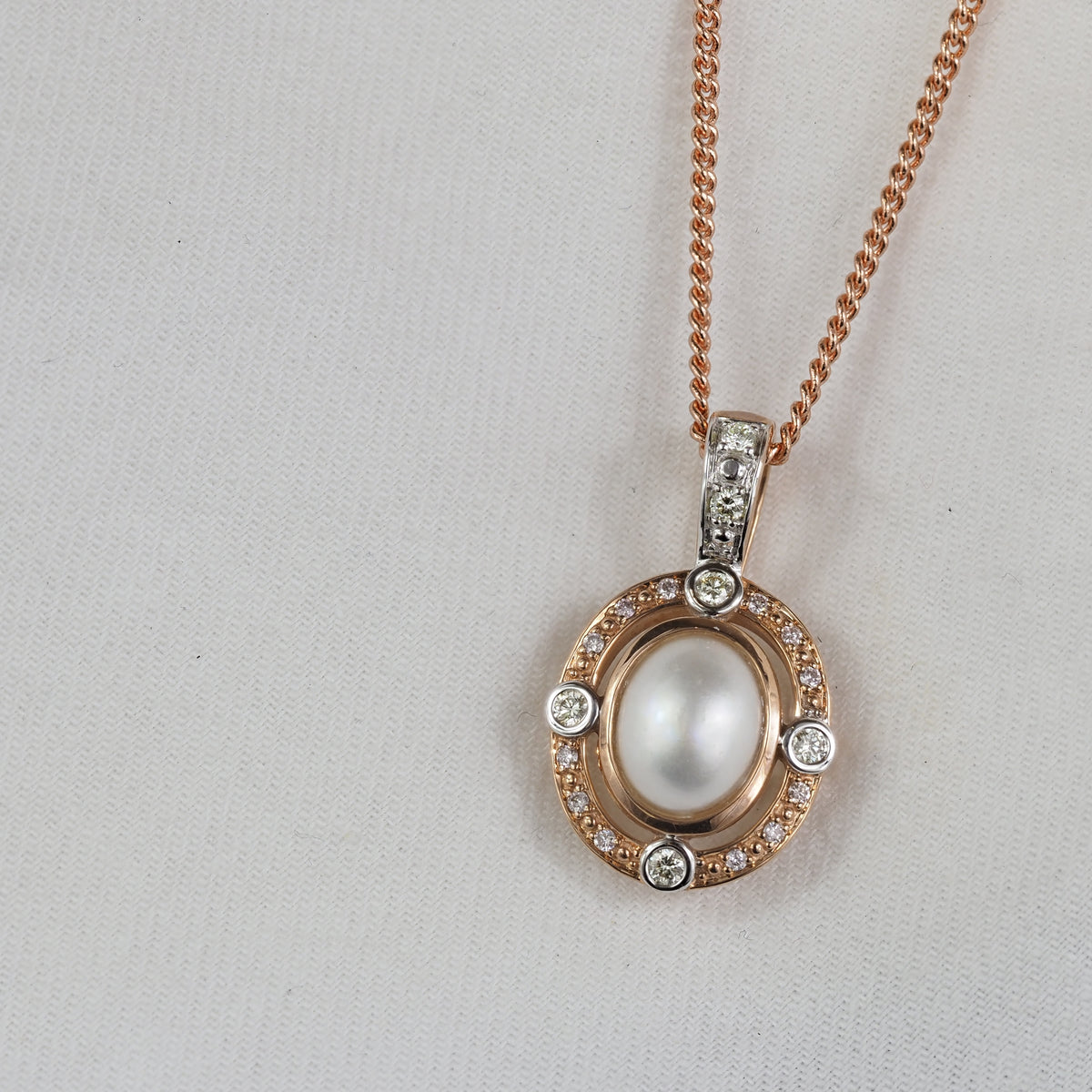 9ct Rose and White 'Pink Caviar' Argyle Diamond and Mabe Pearl enhancer, 0.24cts total.