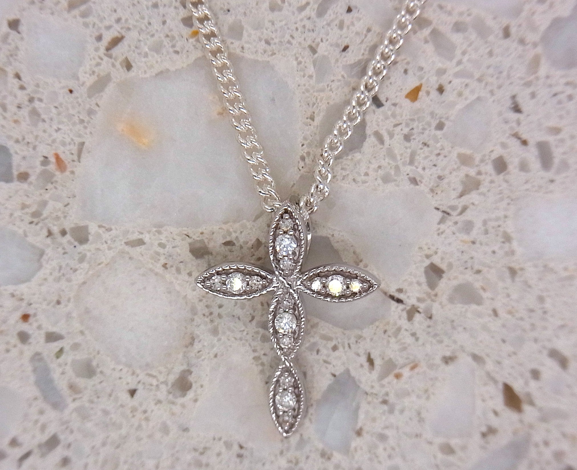 9ct white gold 0.10ct diamond millgrain cross pendant