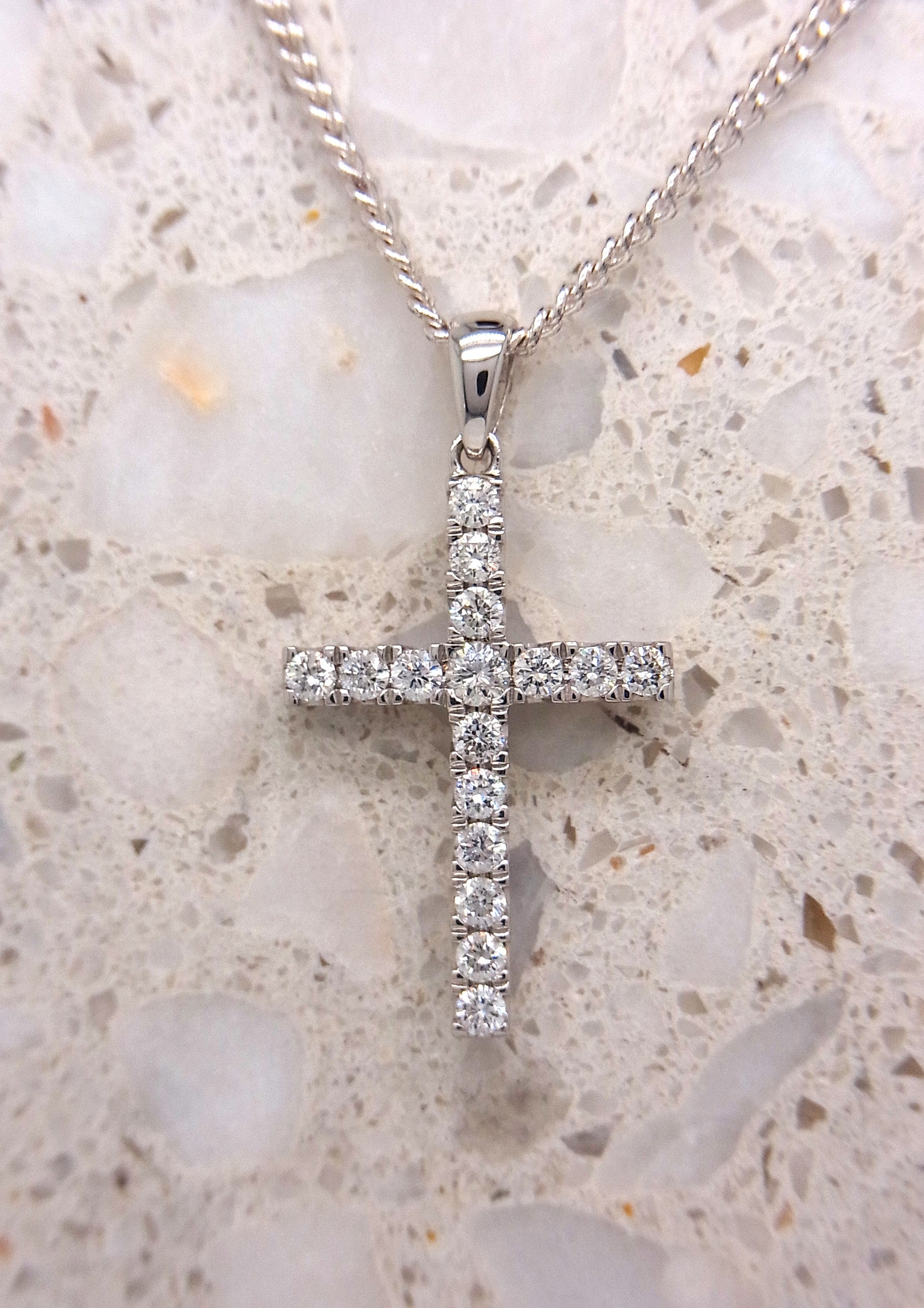 9ct White Gold Diamond claw set cross, 0.25ct total