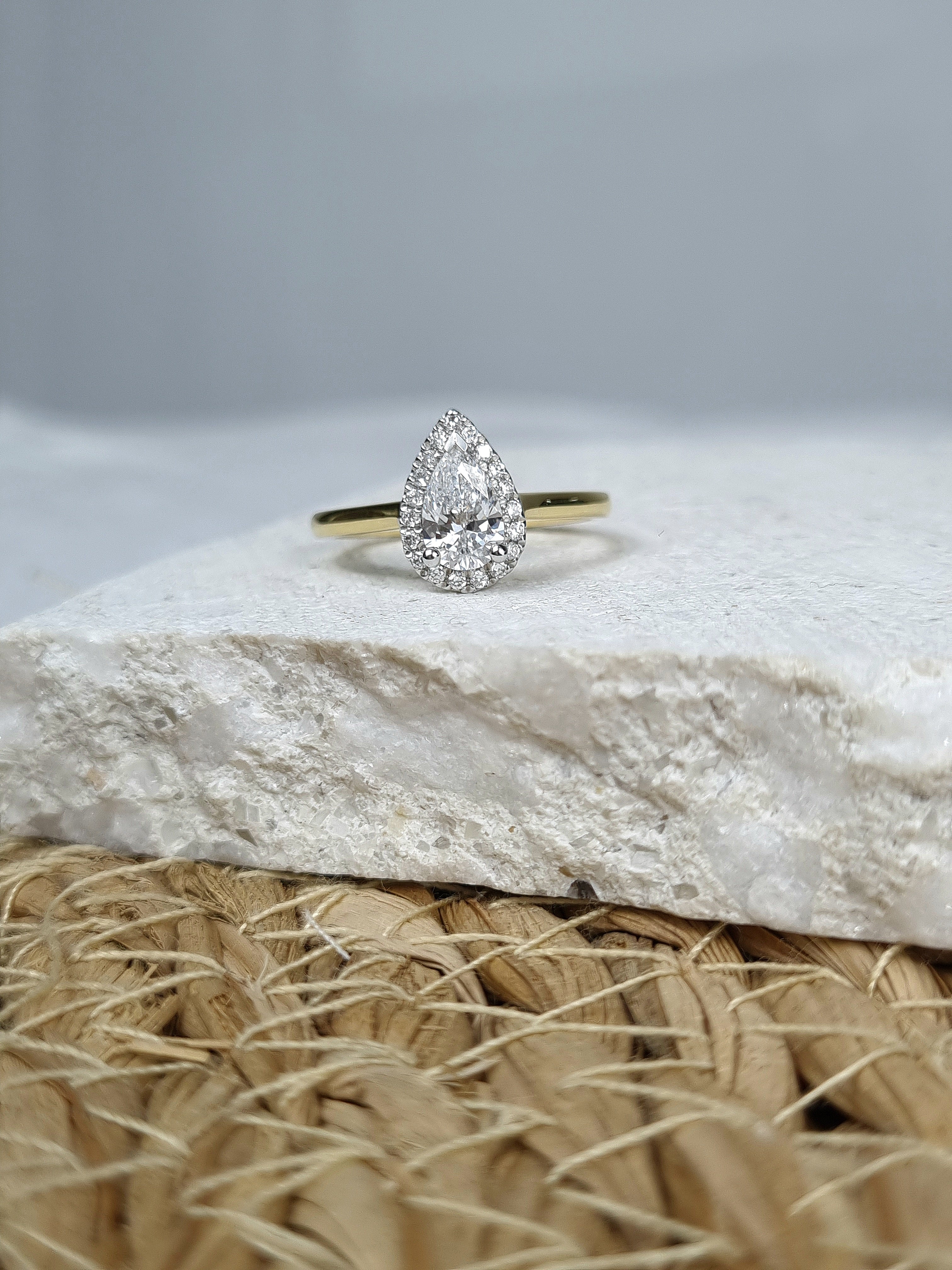 18ct Yellow and White Gold Pear Cut Diamond Ring, 0.70ct Centre