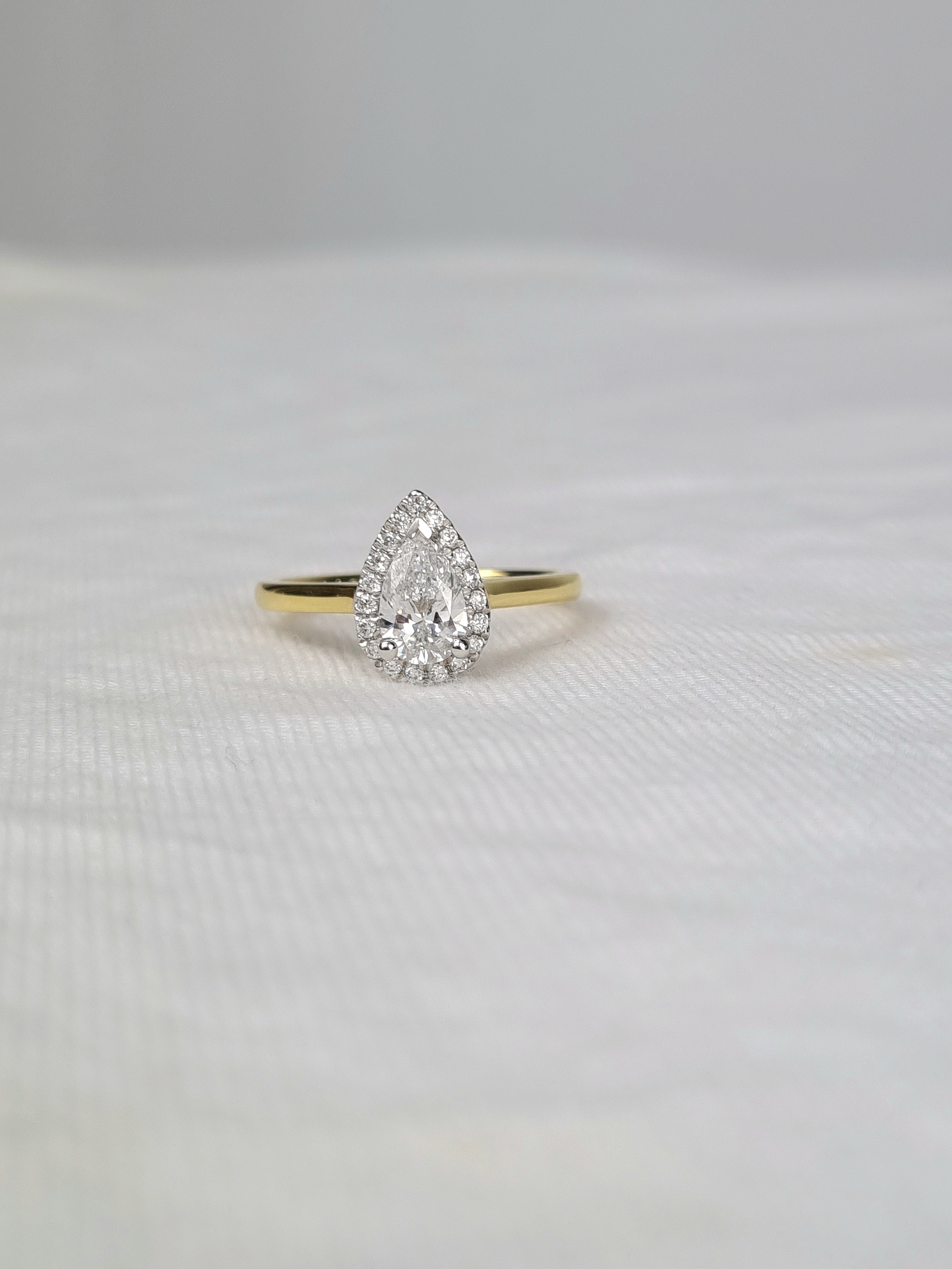 18ct Yellow and White Gold Pear Cut Diamond Ring, 0.70ct Centre