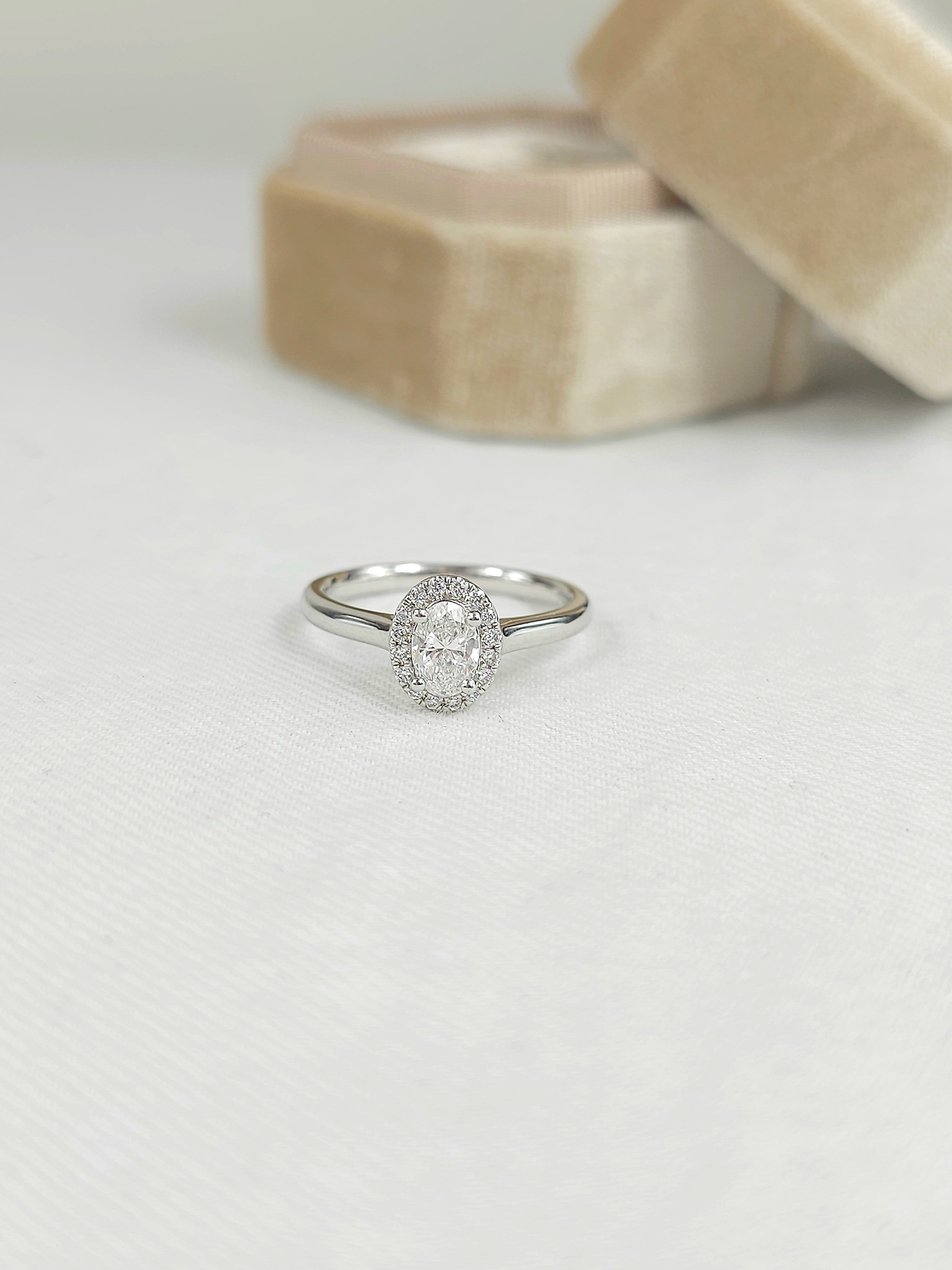 18ct White Gold Oval Halo Ring, 0.50 carat centre.