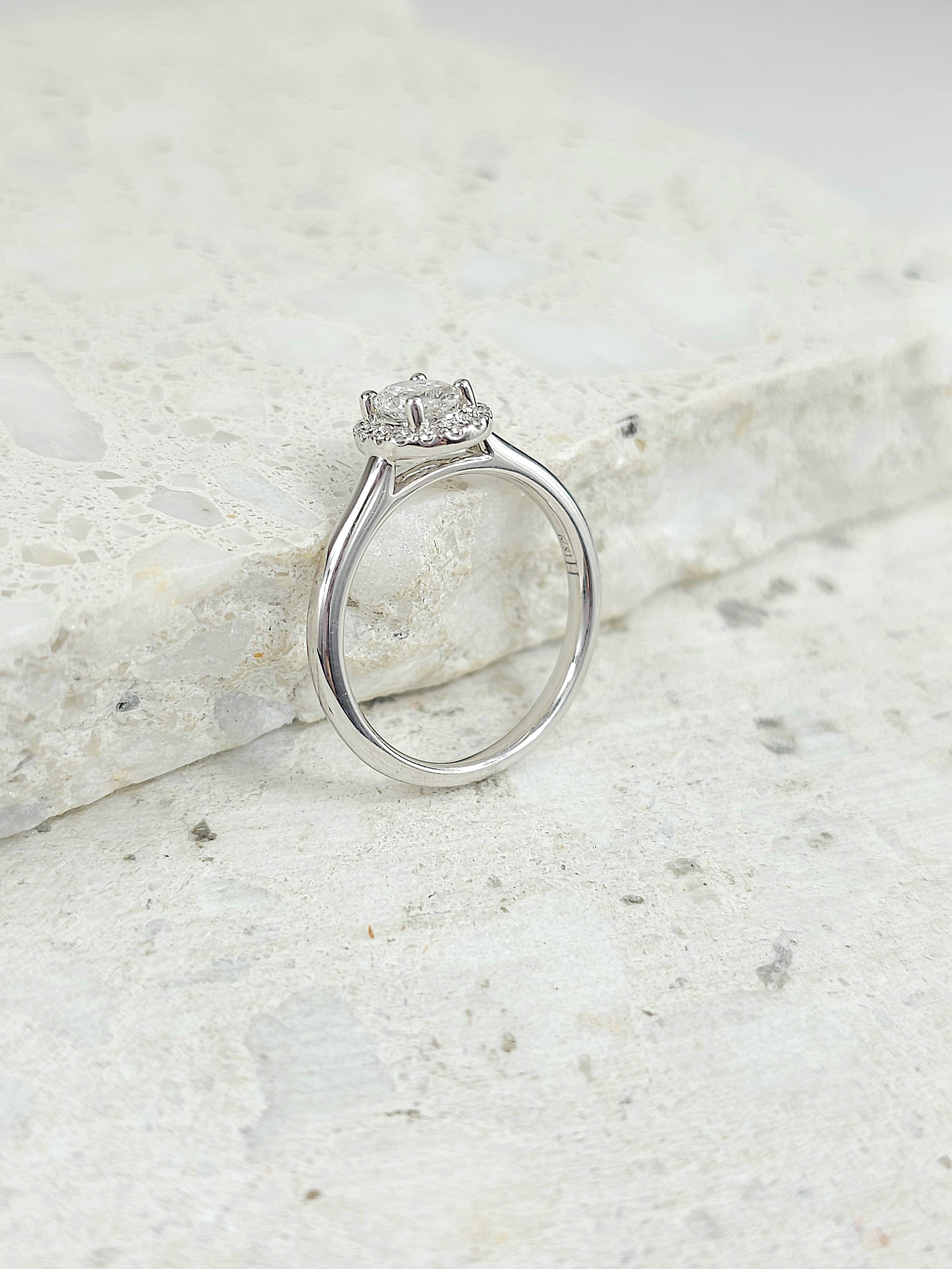 18ct White Gold Oval Halo Ring, 0.50 carat centre.