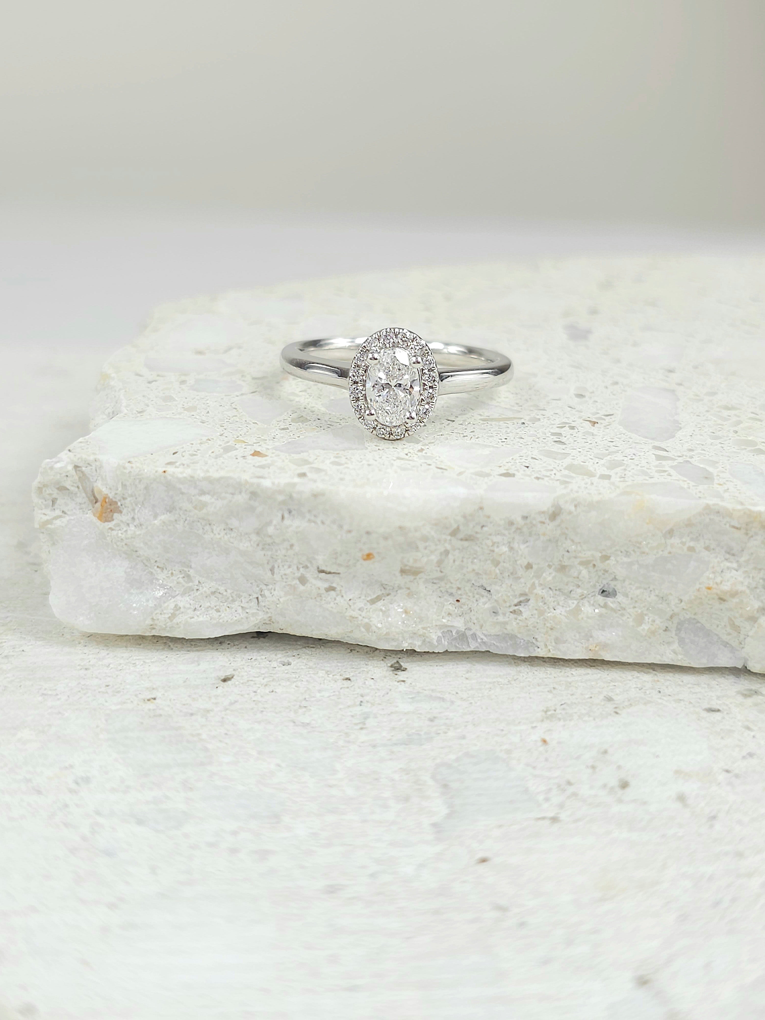 18ct White Gold Oval Halo Ring, 0.50 carat centre.
