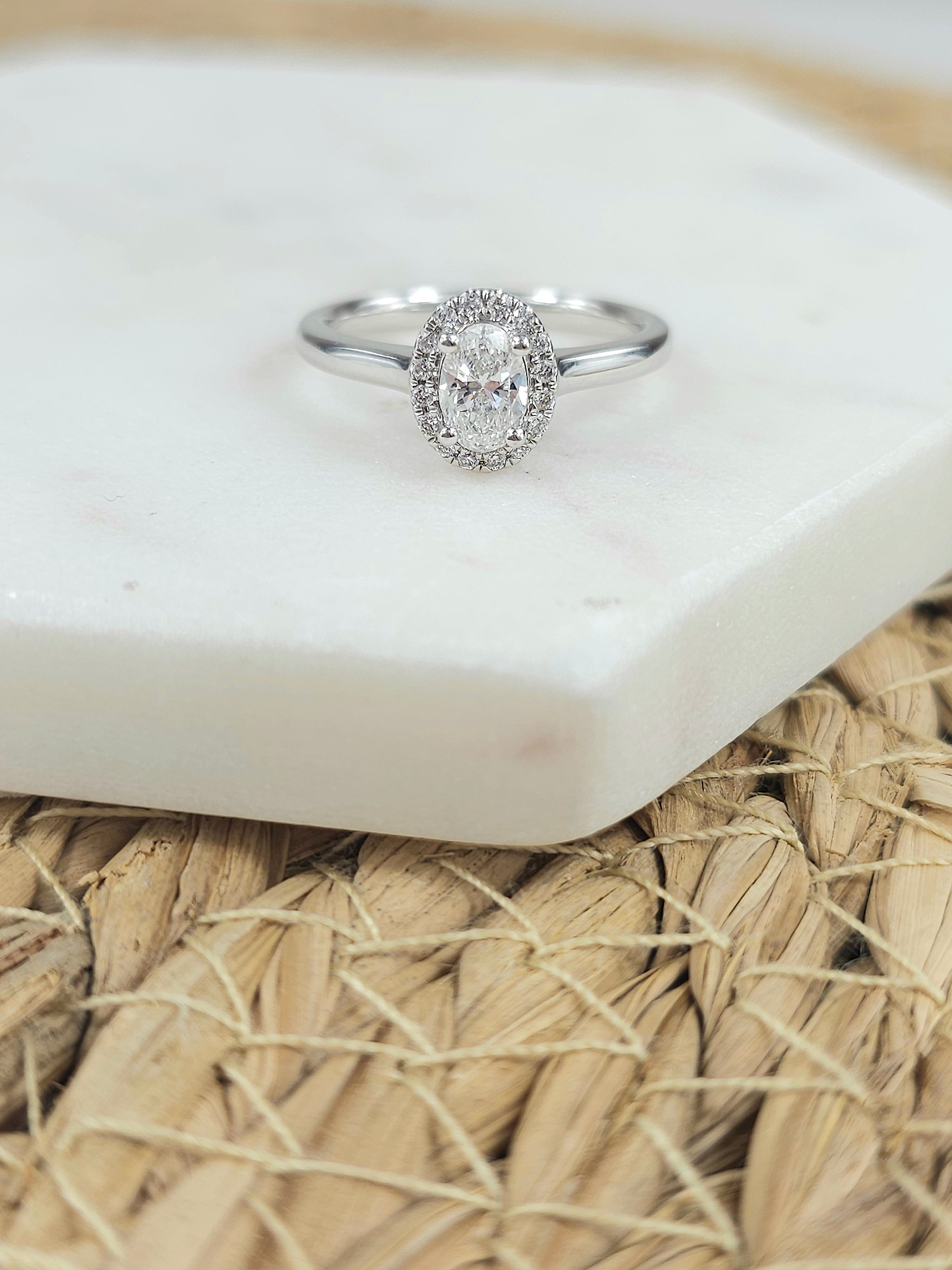18ct White Gold Oval Halo Ring, 0.50 carat centre.