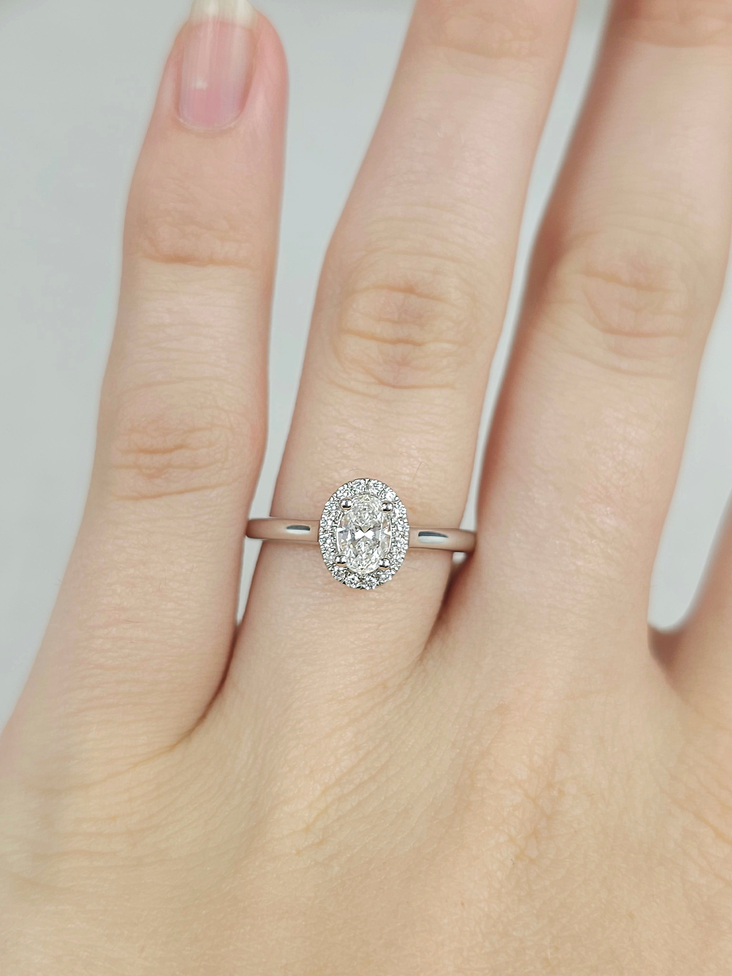 18ct White Gold Oval Halo Ring, 0.50 carat centre.