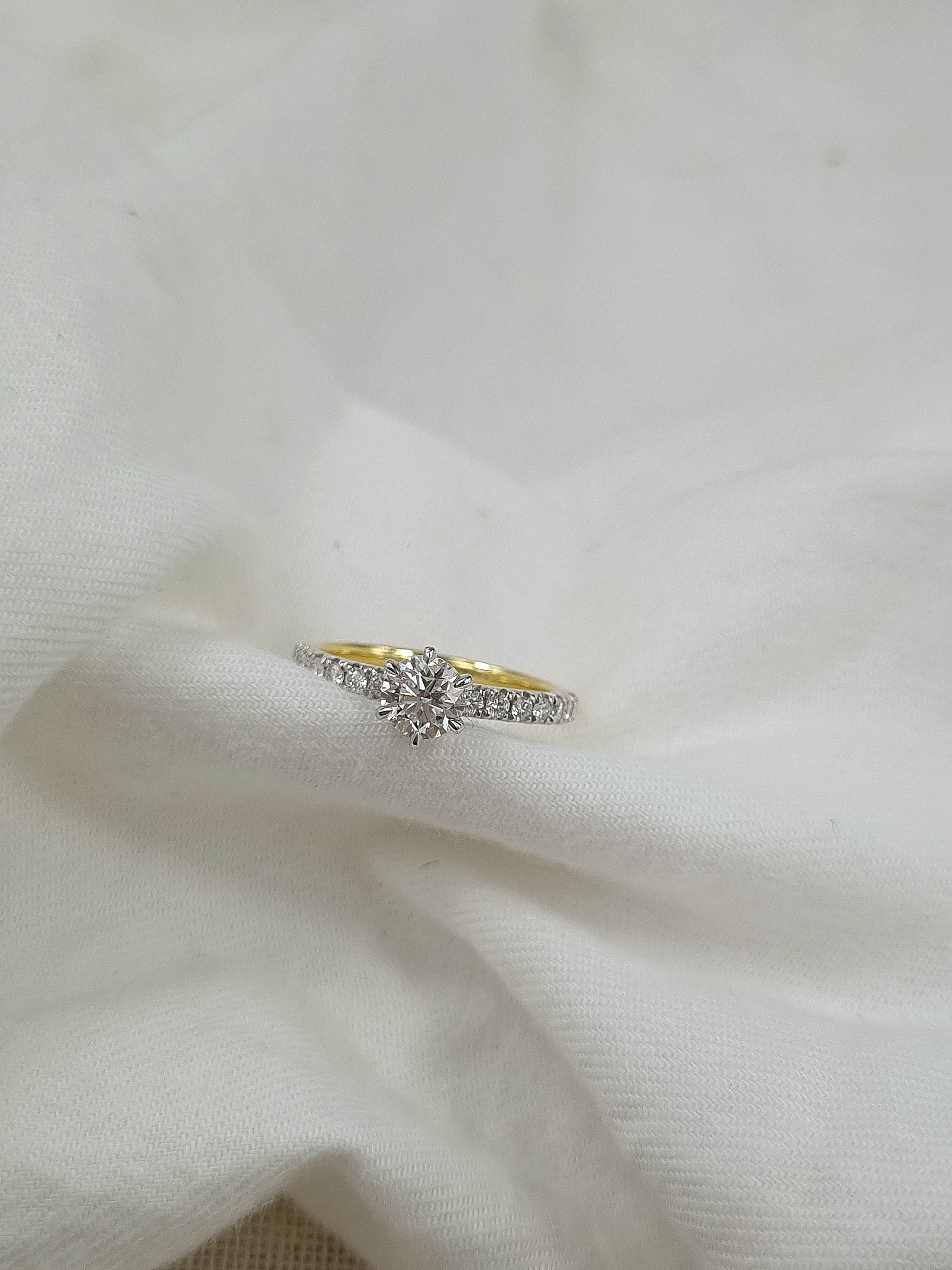 18ct Yellow and White Gold Round Brillant Cut Diamond Engagement Ring, 0.70ct Centre