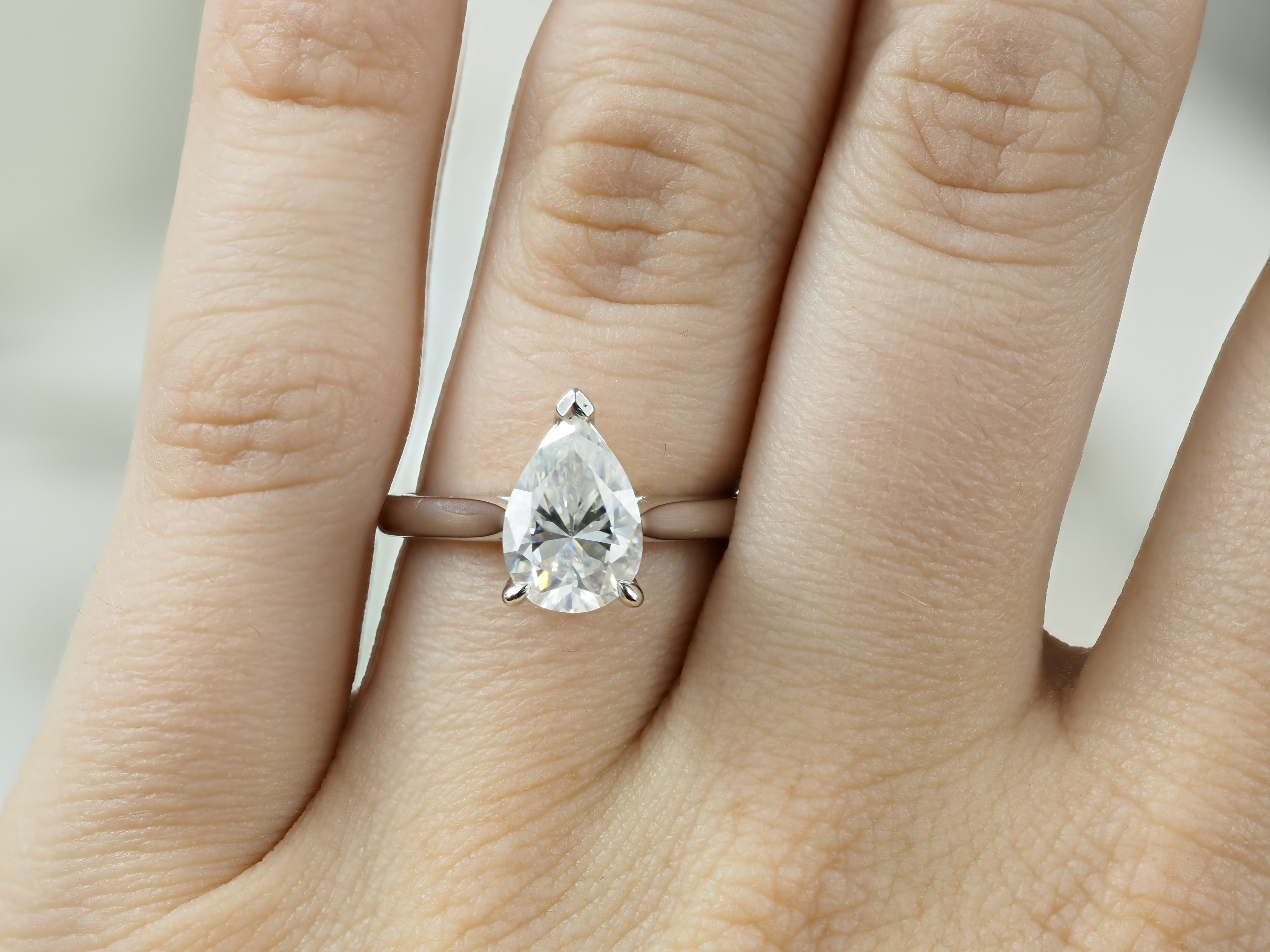 9ct White Gold Moissanite Pear Solitaire.