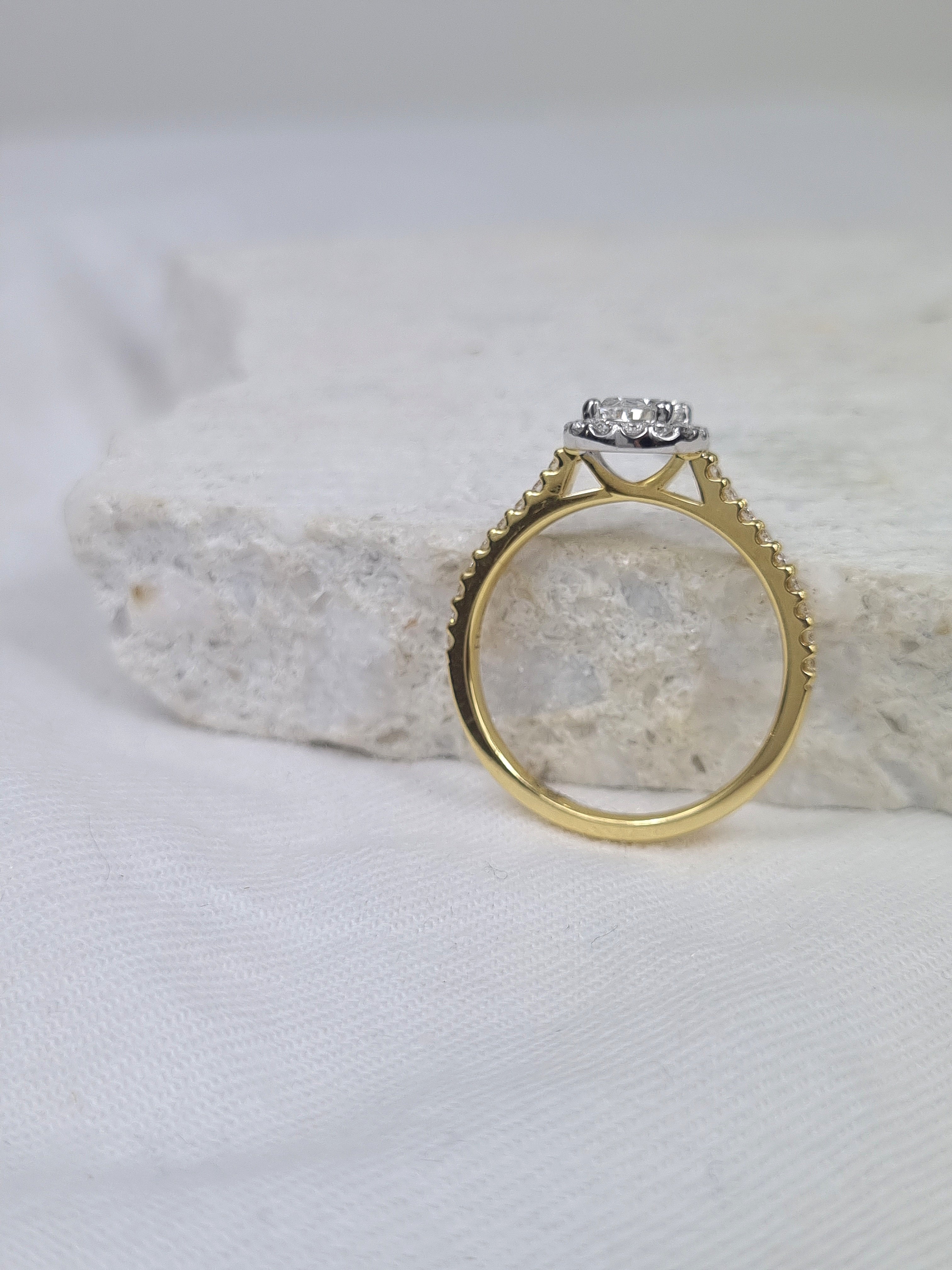 18ct Yellow and White Gold Oval Halo Engagement Ring, 0.56ct centre