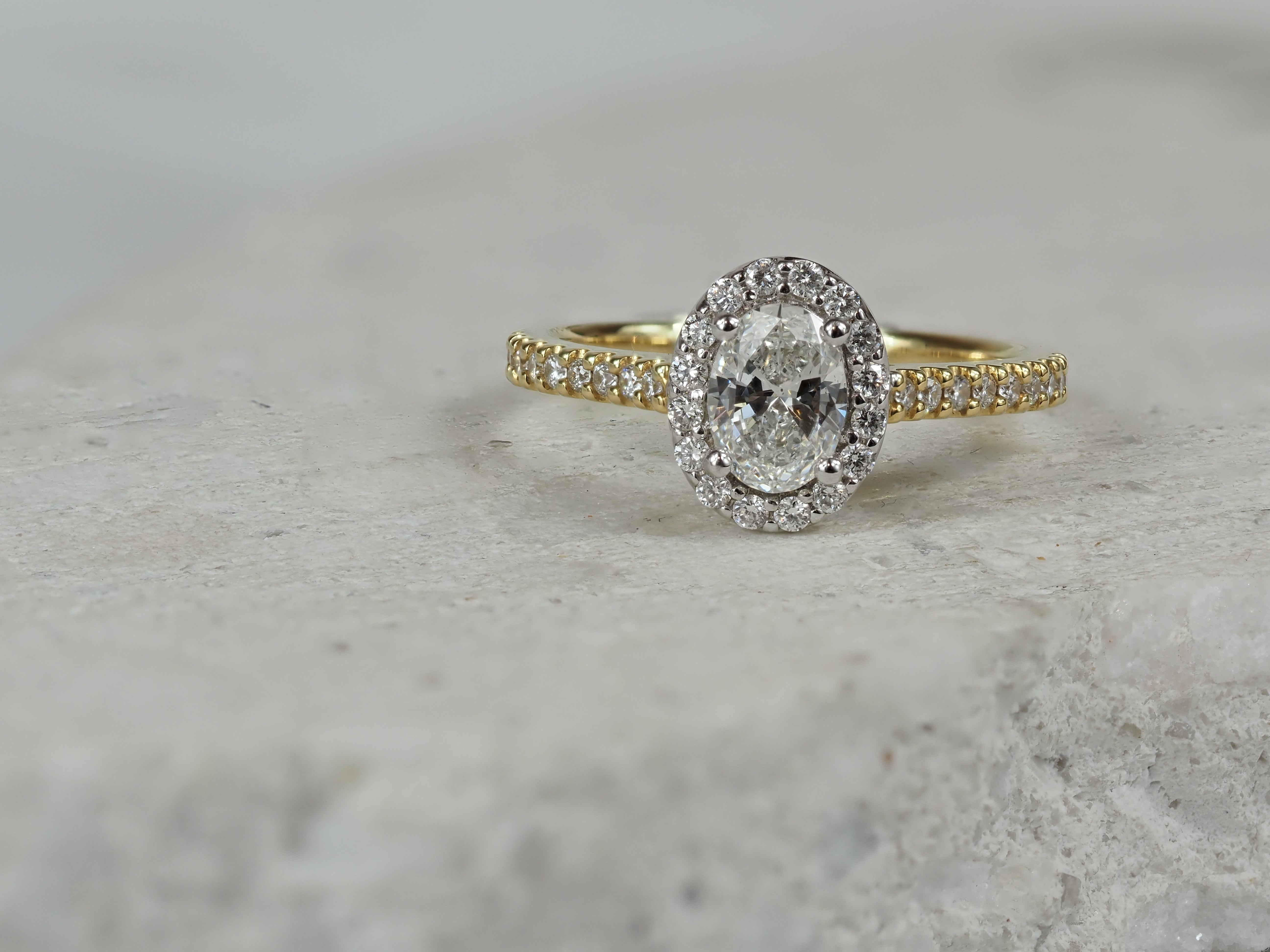 18ct Yellow and White Gold Oval Halo Engagement Ring, 0.56ct centre