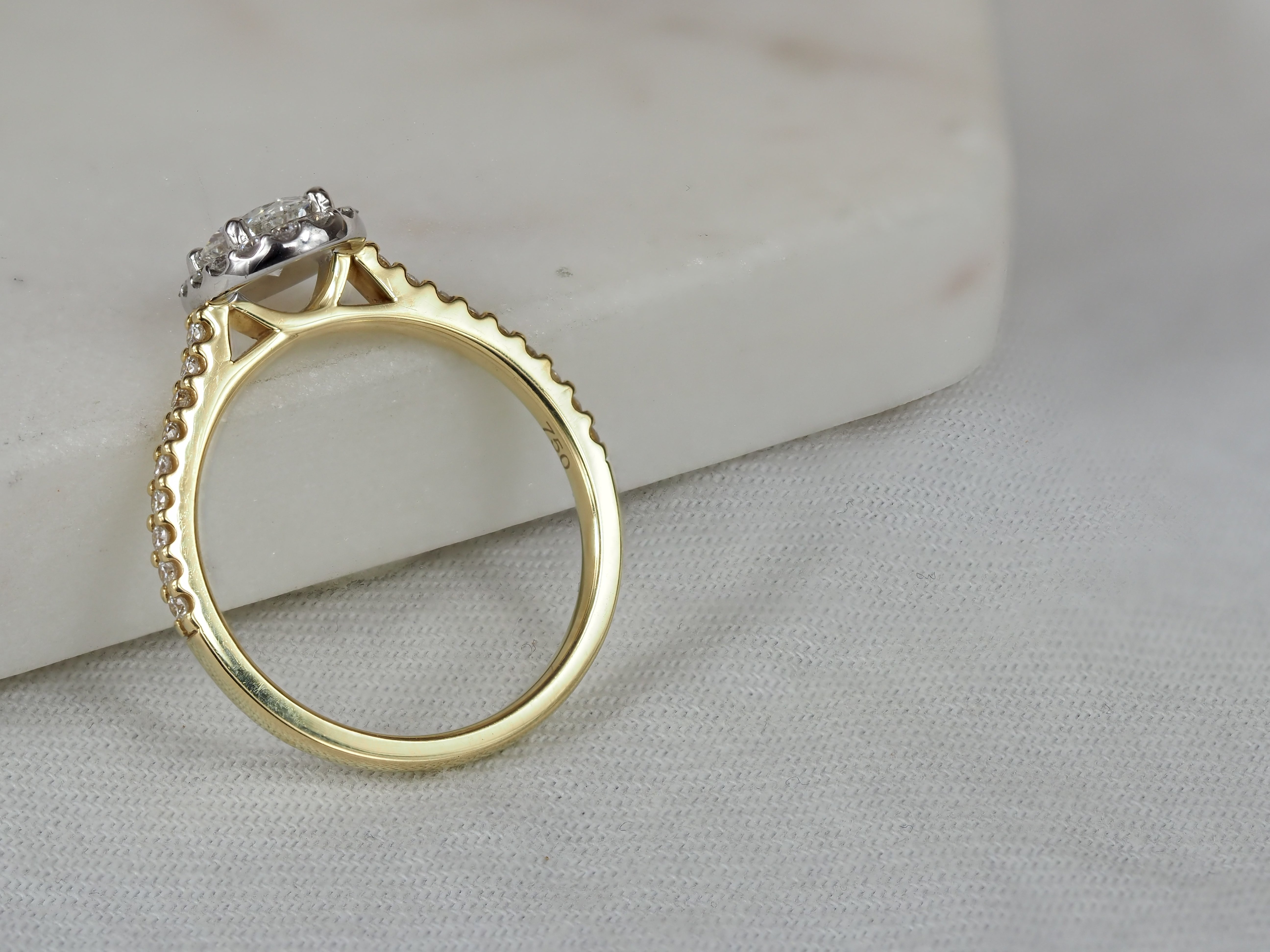 18ct Yellow and White Gold Oval Halo Engagement Ring, 0.56ct centre