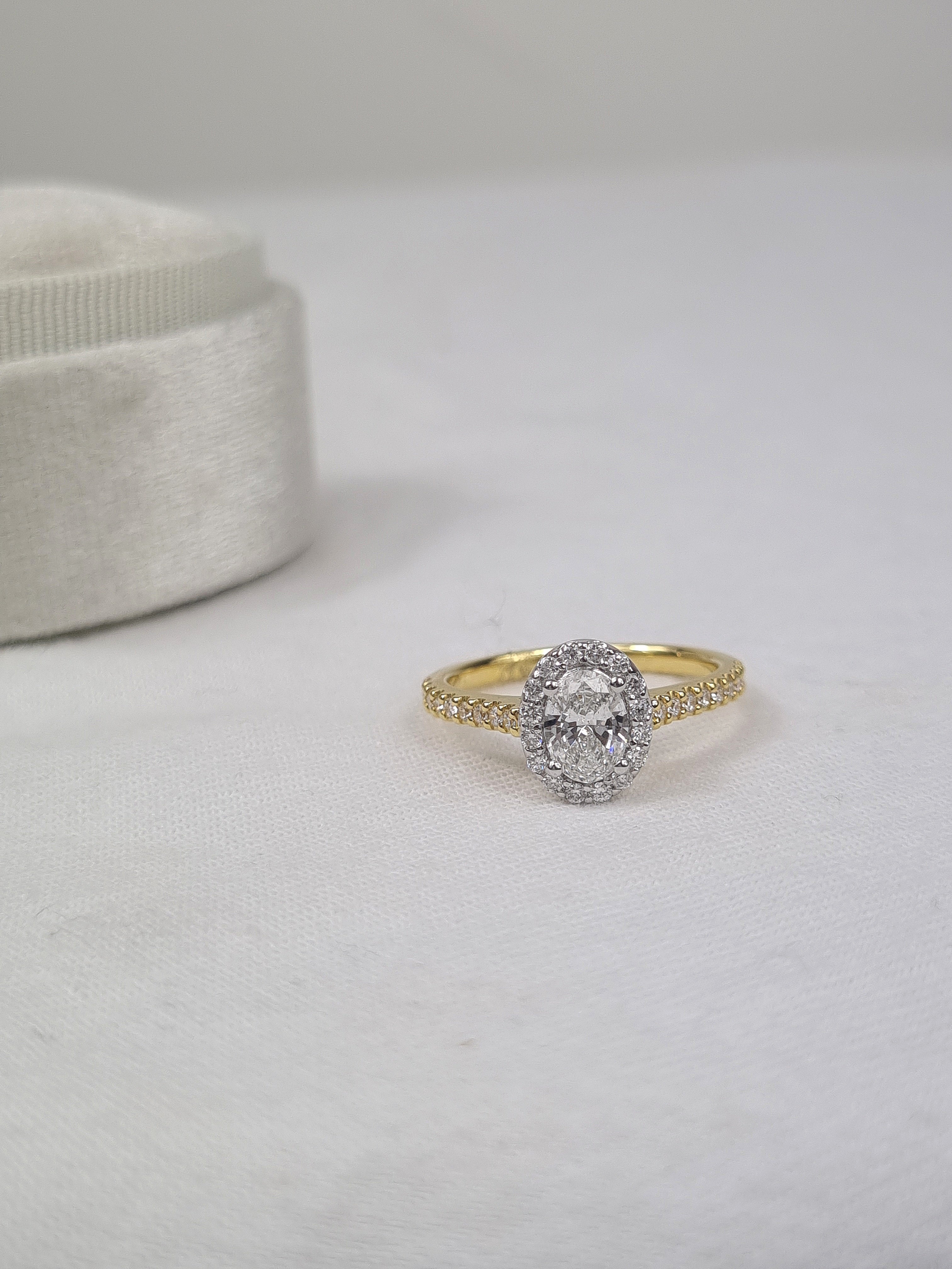18ct Yellow and White Gold Oval Halo Engagement Ring, 0.56ct centre