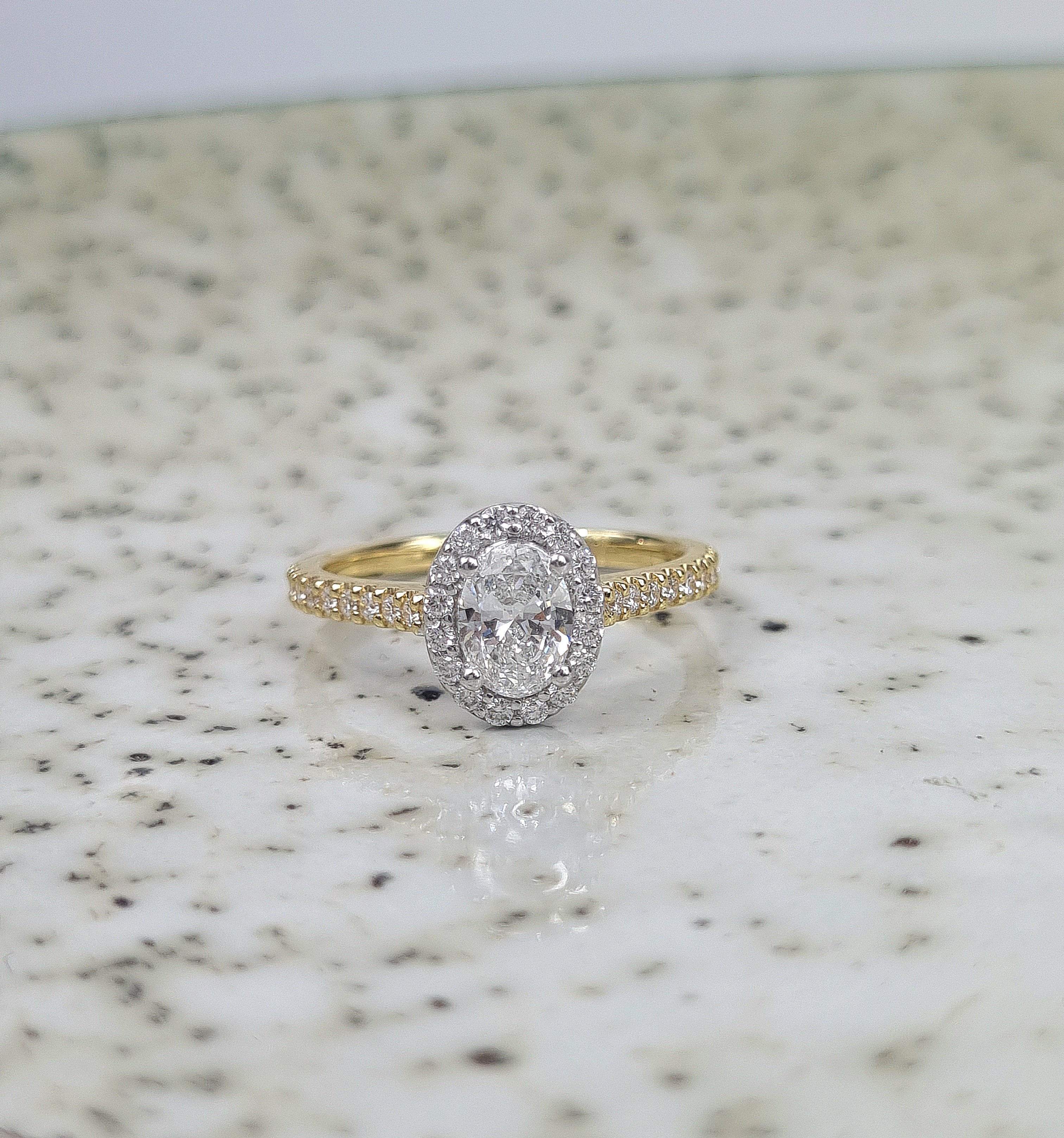 18ct Yellow and White Gold Oval Halo Engagement Ring, 0.56ct centre