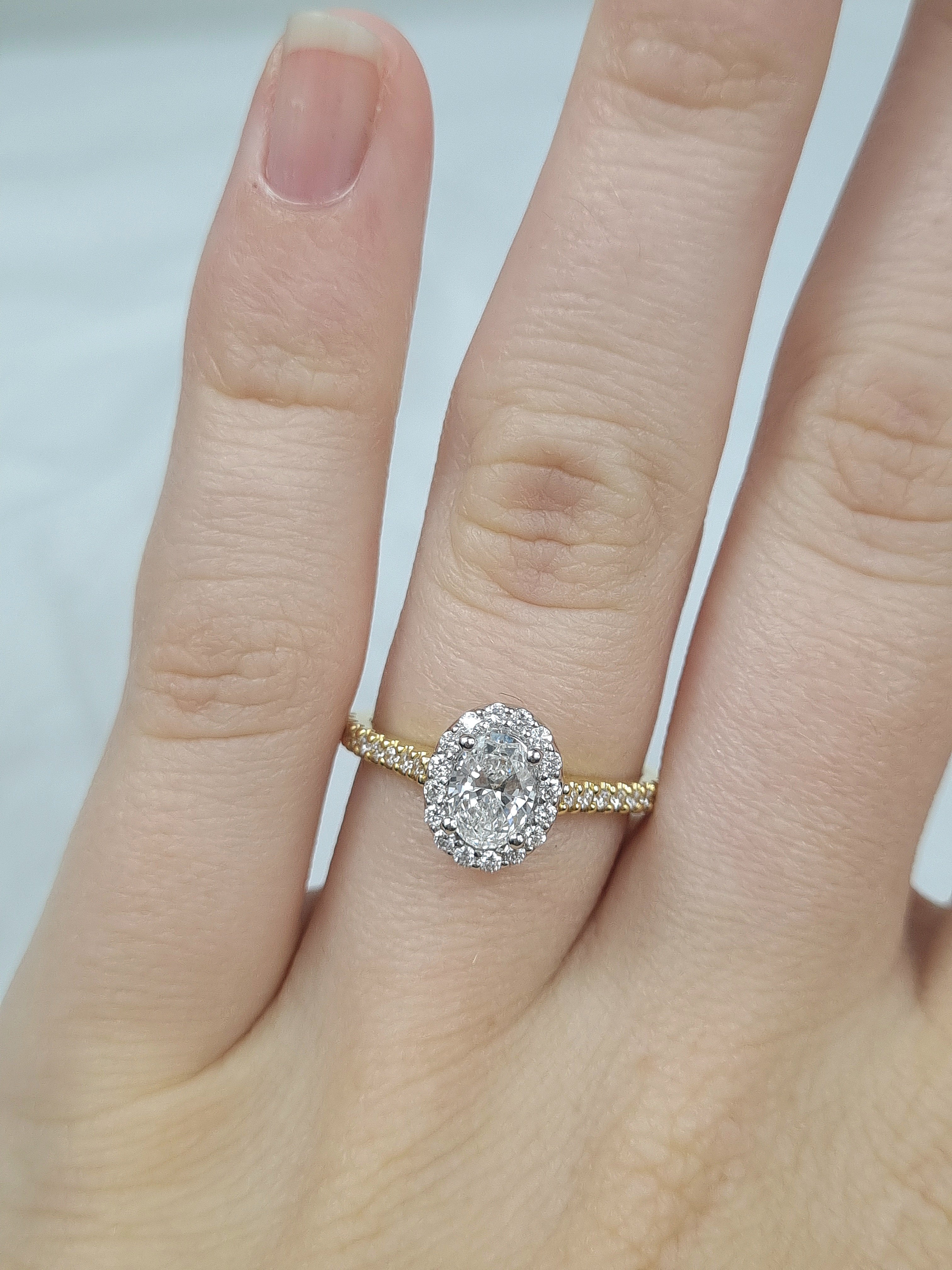 18ct Yellow and White Gold Oval Halo Engagement Ring, 0.56ct centre