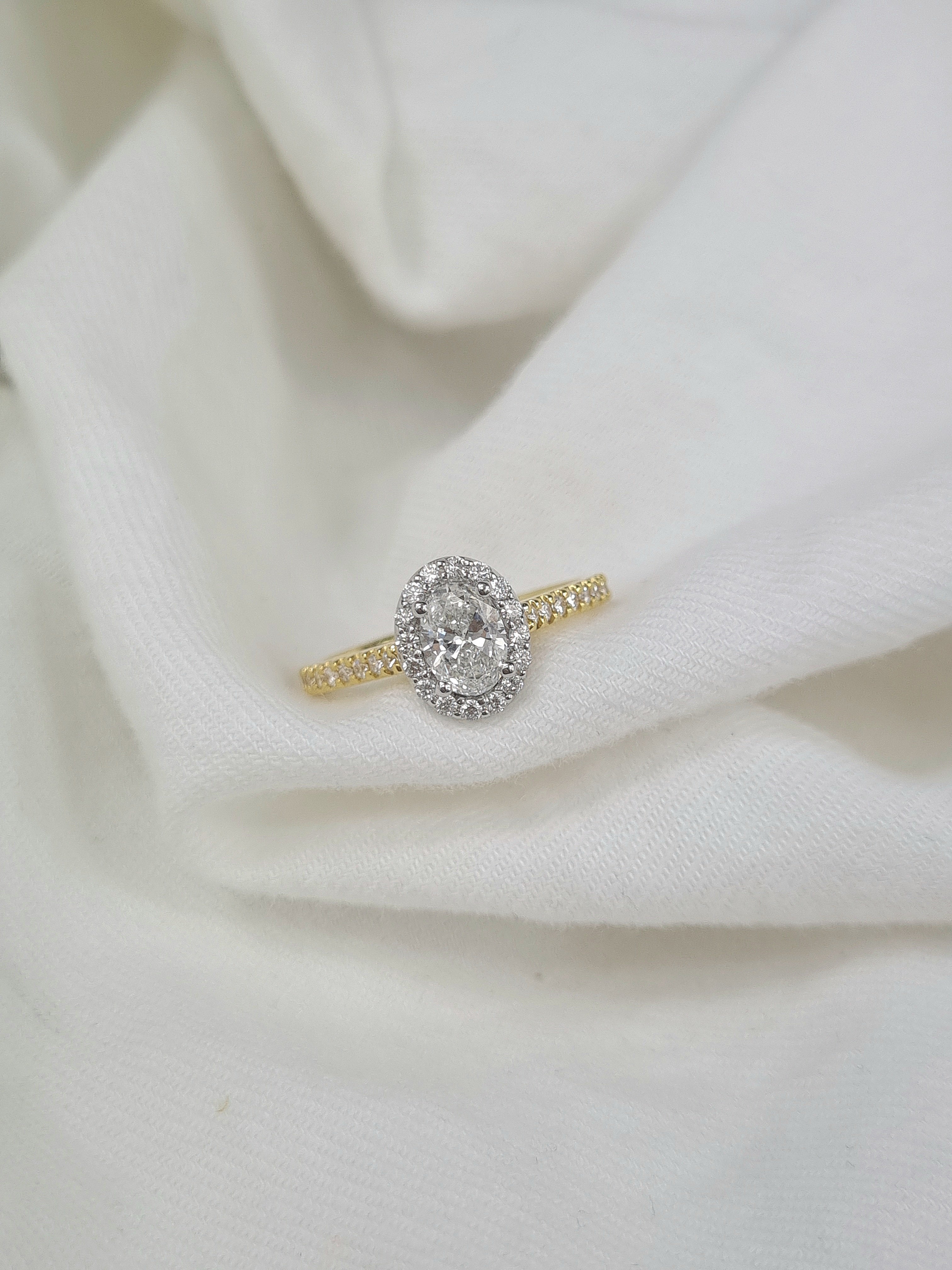 18ct Yellow and White Gold Oval Halo Engagement Ring, 0.56ct centre
