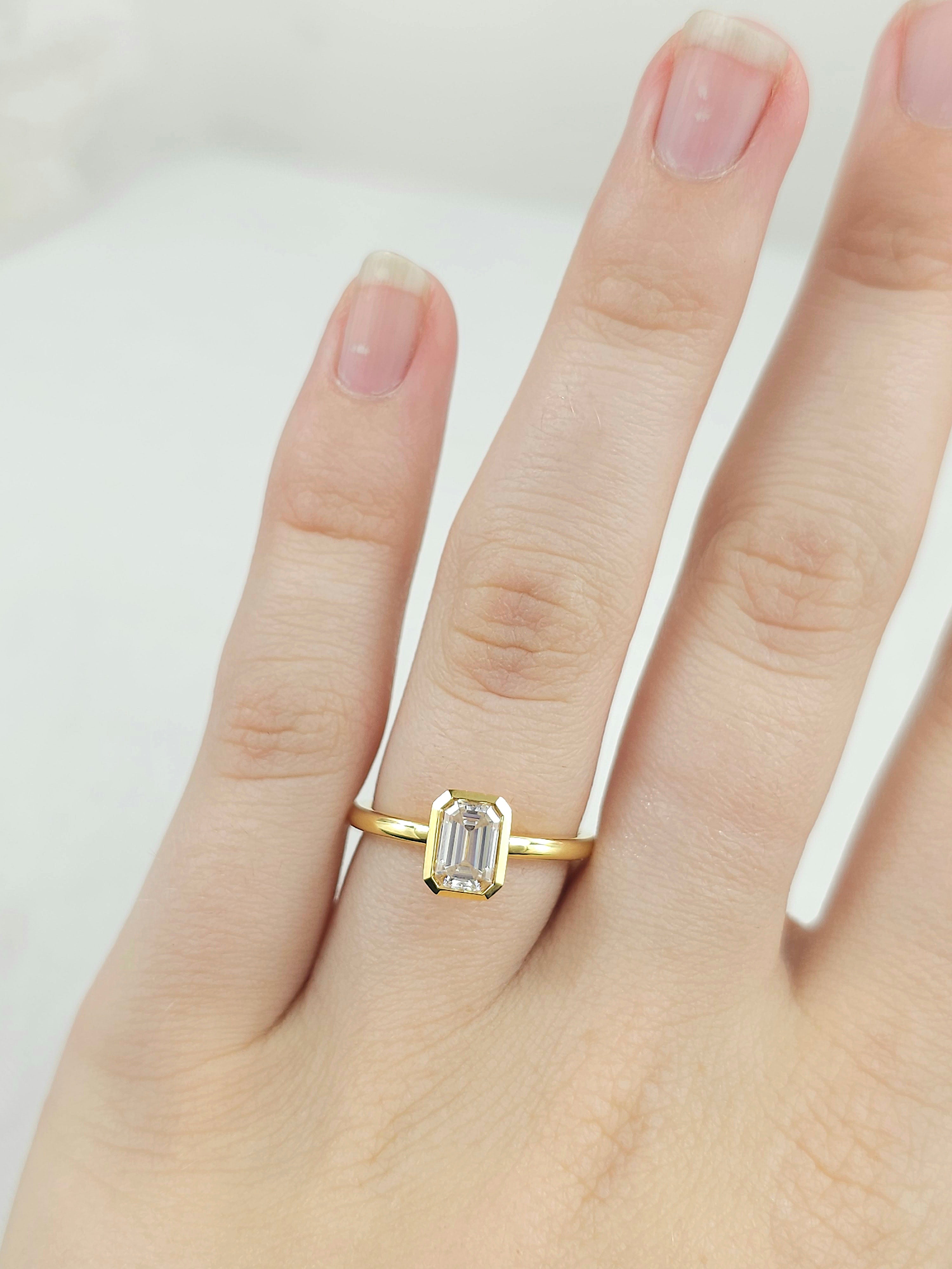 18ct Yellow Gold Emerald Cut Moissanite Solitaire.