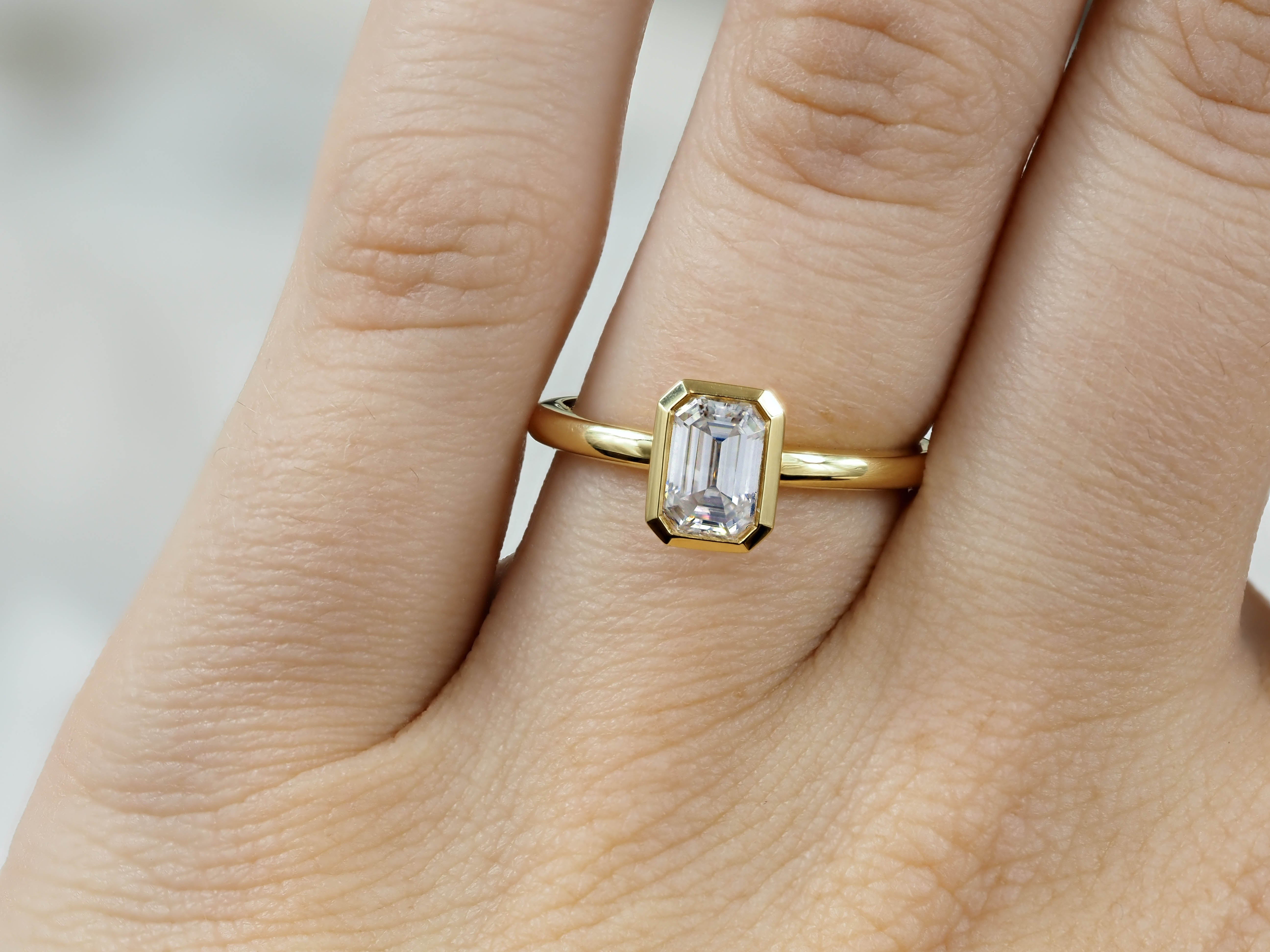 18ct Yellow Gold Emerald Cut Moissanite Solitaire.