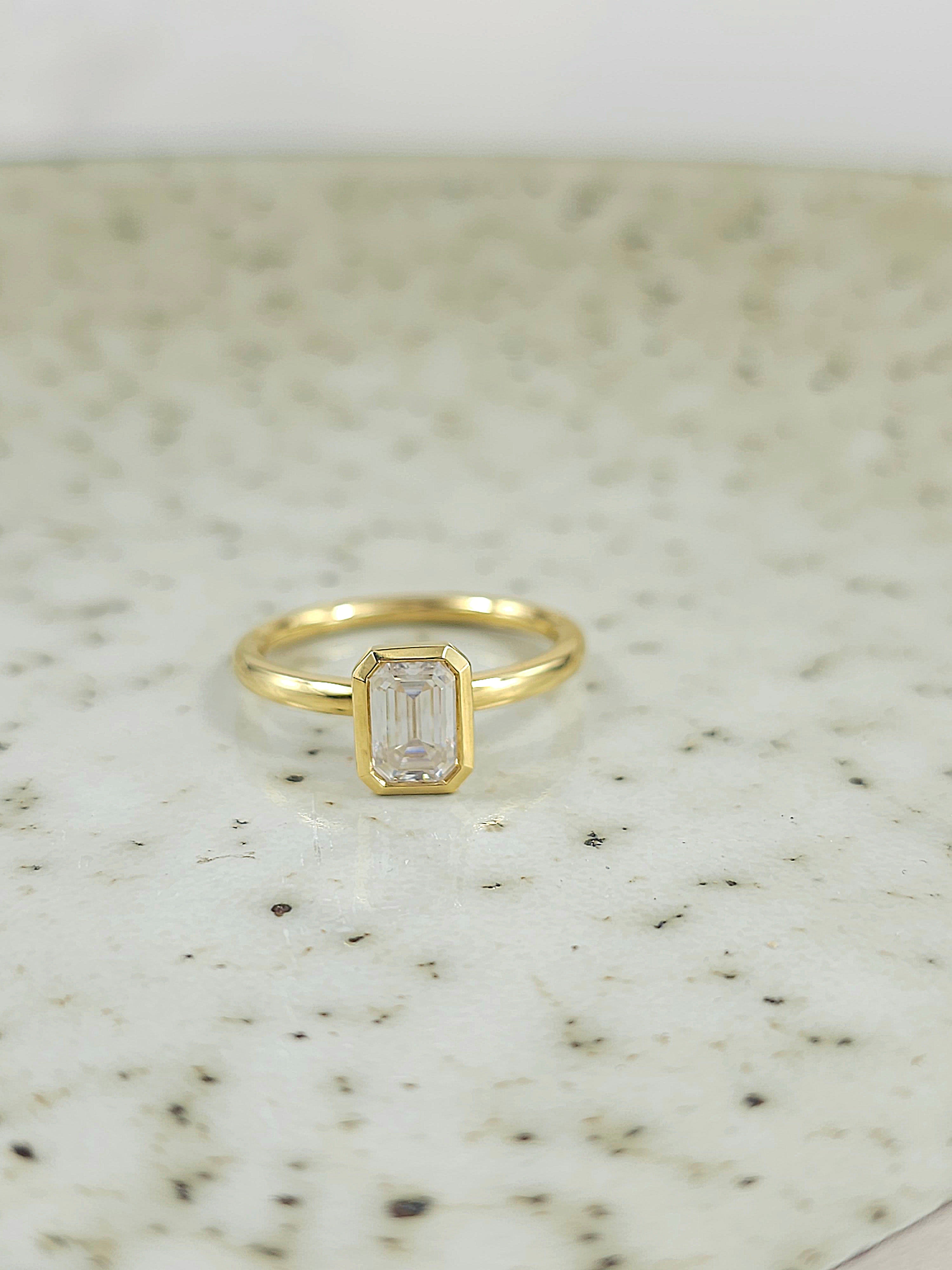 18ct Yellow Gold Emerald Cut Moissanite Solitaire.