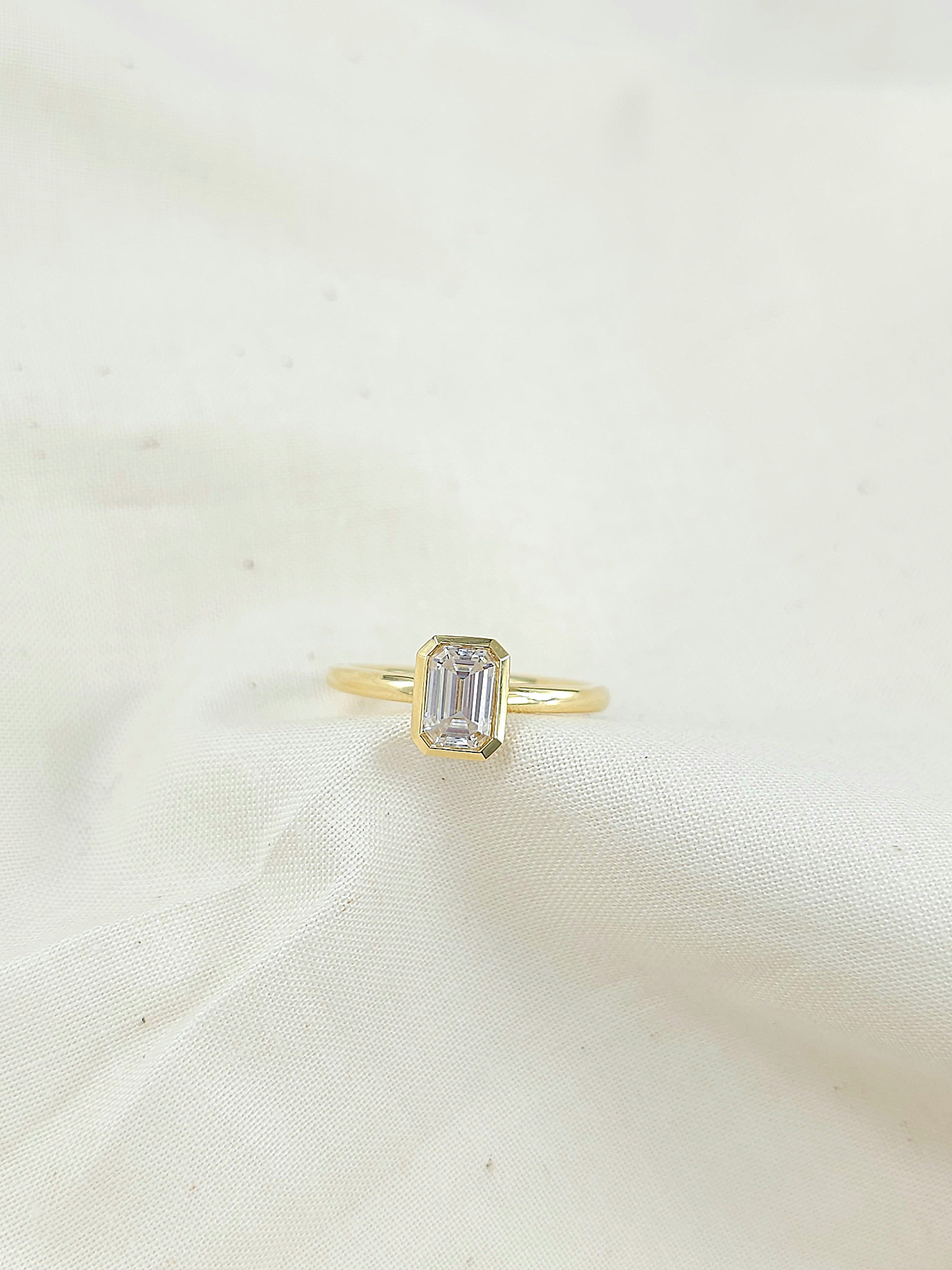 18ct Yellow Gold Emerald Cut Moissanite Solitaire.