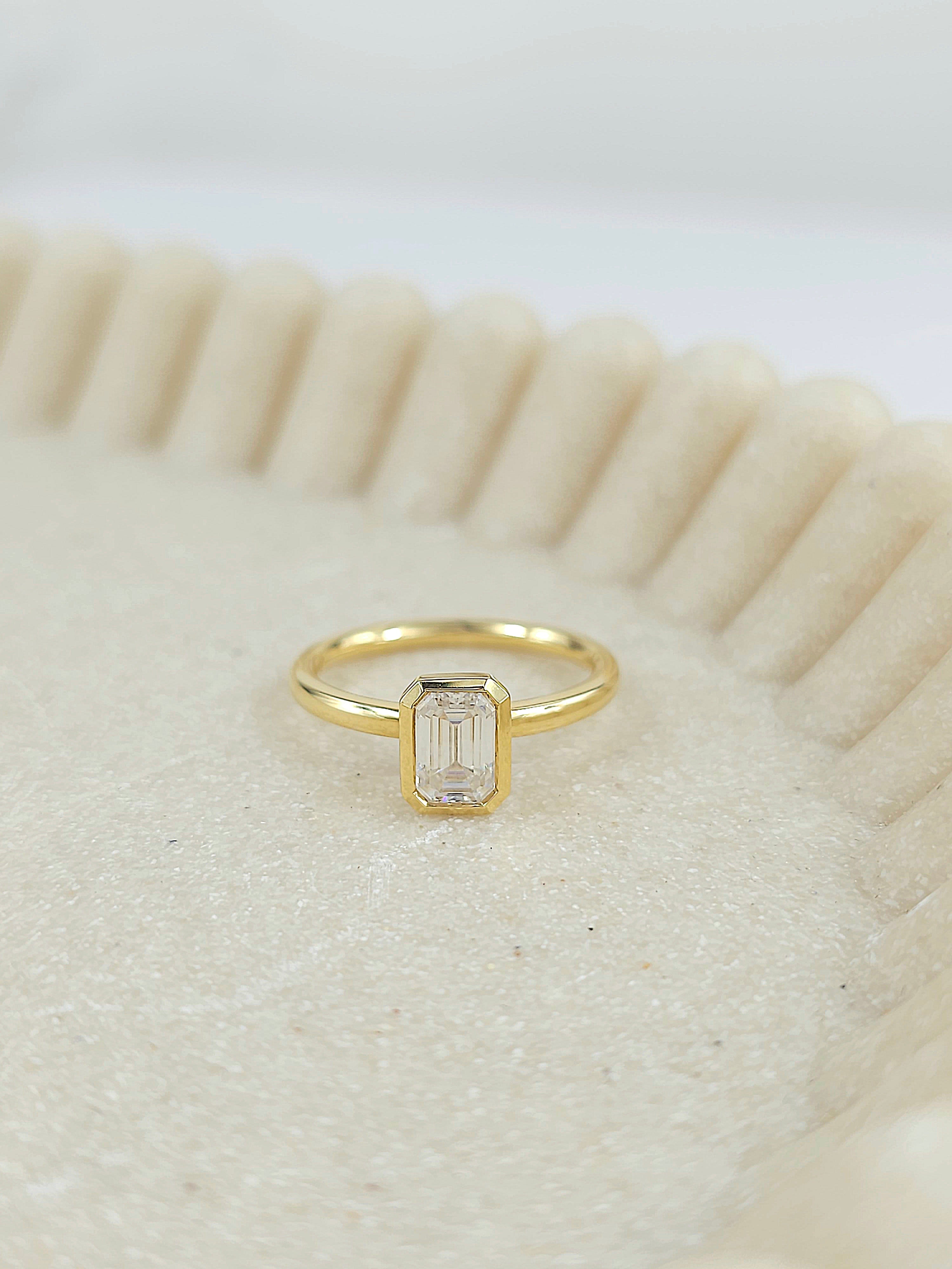 18ct Yellow Gold Emerald Cut Moissanite Solitaire.