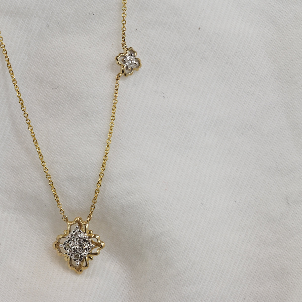 9ct Yellow and White Gold Diamond necklet, 0.028ct total